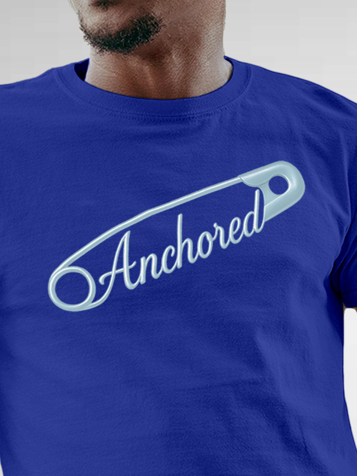 Close up of 'Anchored' design on Men's Blue Round Neck T-shirt, highlighting intricate details and vibrant print.