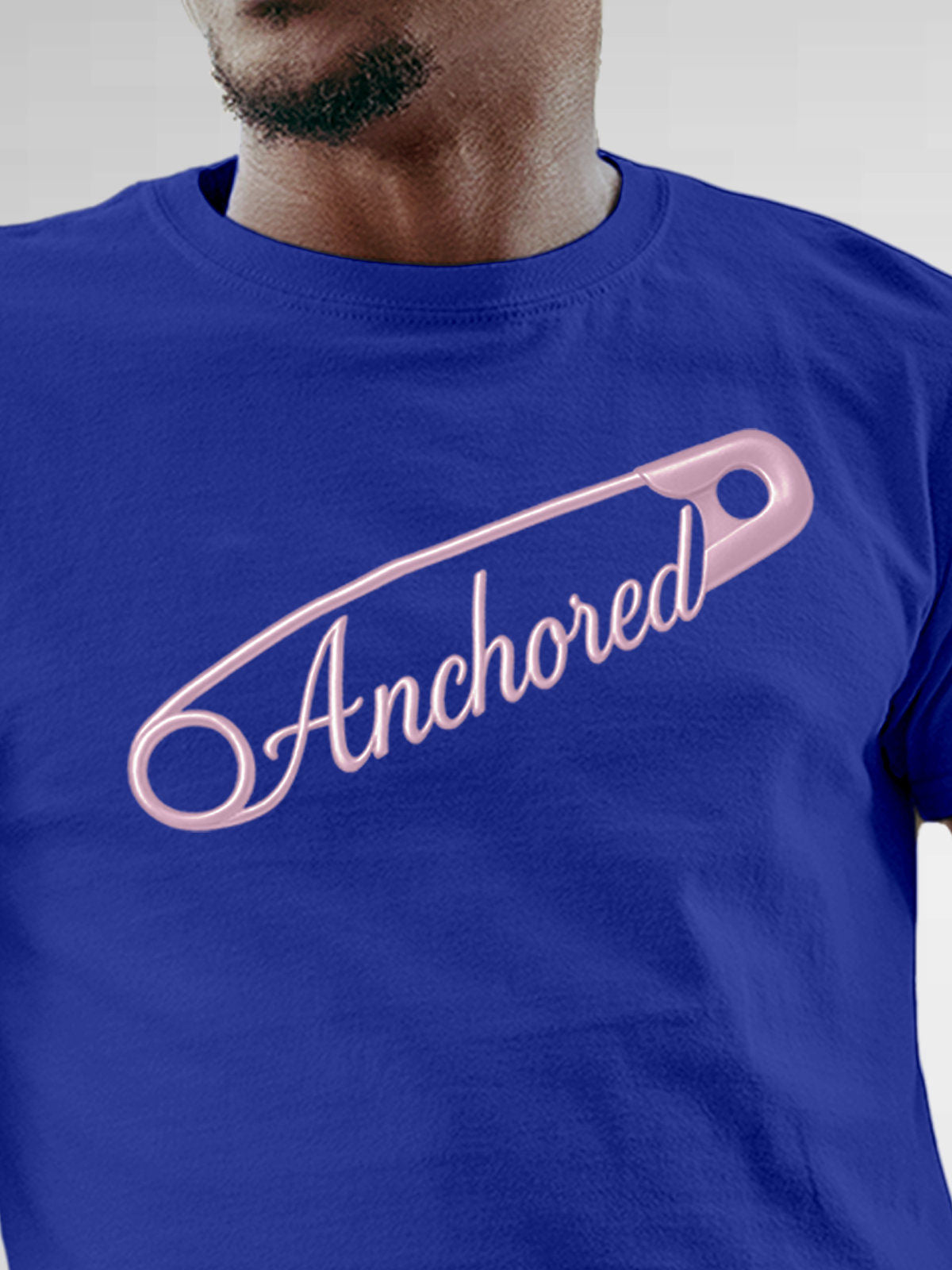 Close up of 'Anchored' design on Men's Blue Round Neck T-shirt, highlighting intricate details and vibrant print.