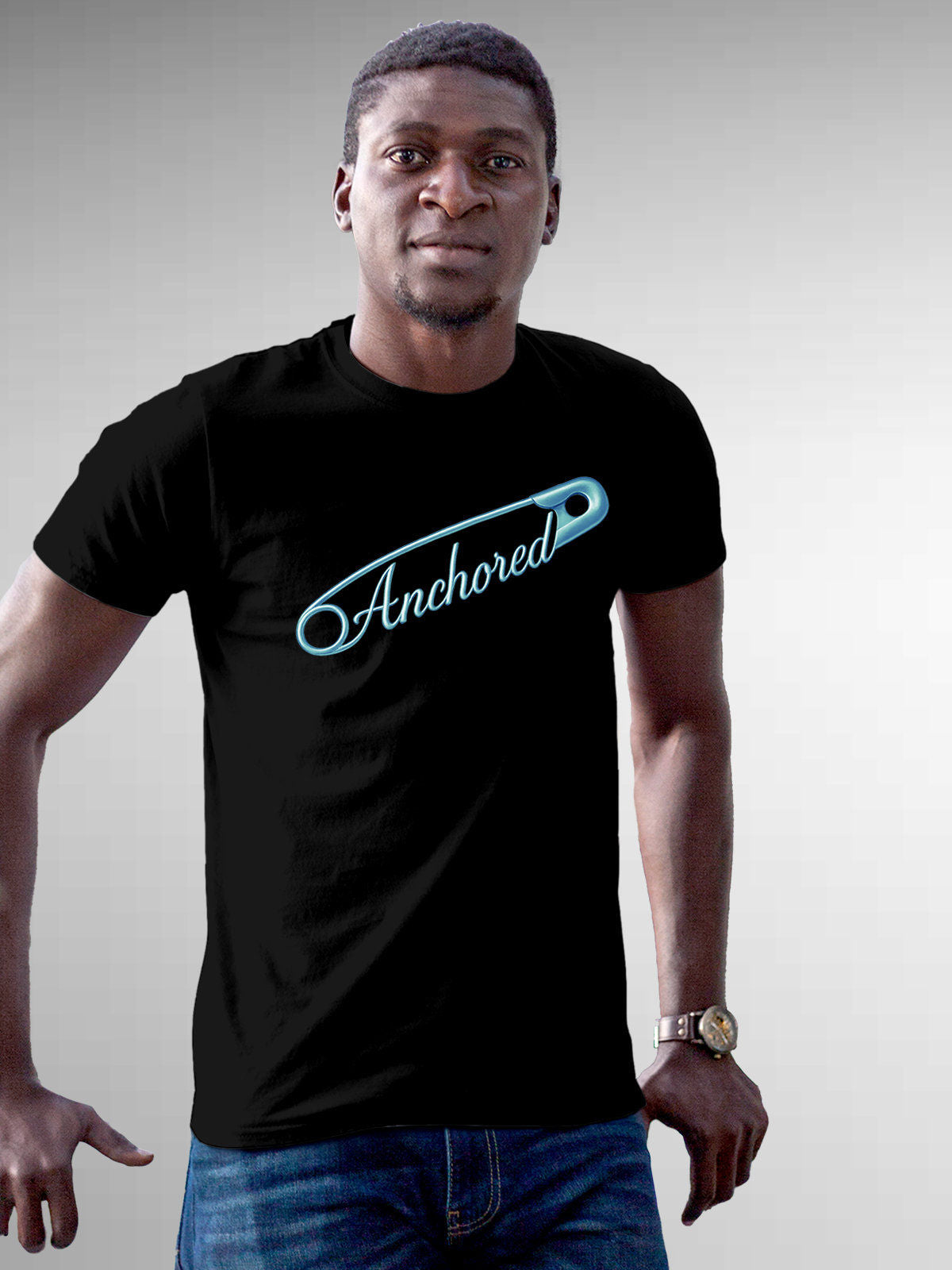 Model wearing Men's Black Round Neck T-shirt with 'Anchored' design, offering effortless style and premium comfort