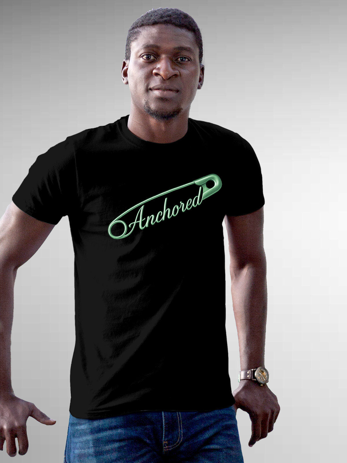 Model wearing Men's Black Round Neck T-shirt with 'Anchored' design, offering effortless style and premium comfort