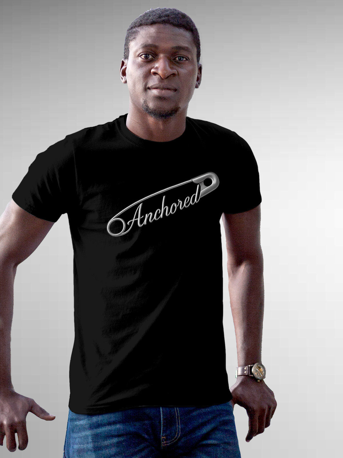 Model wearing Men's Black Round Neck T-shirt with 'Anchored' design, offering effortless style and premium comfort