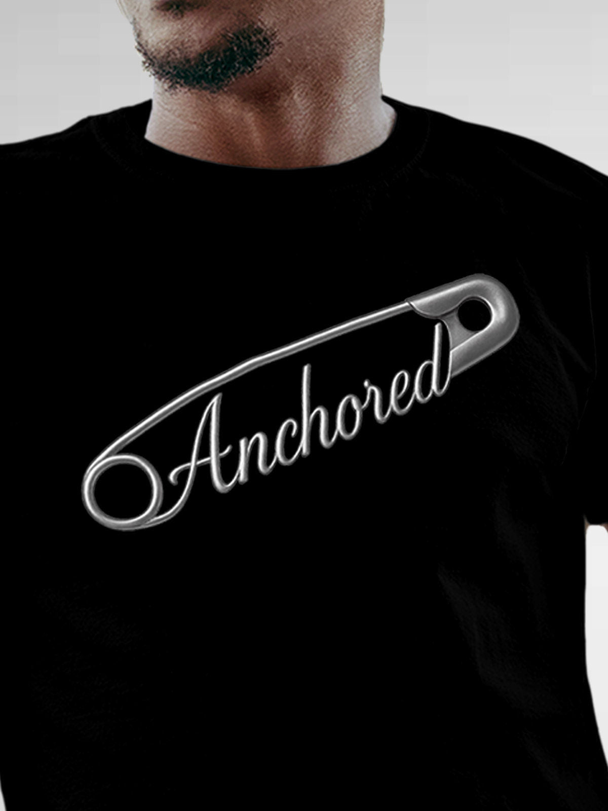 Close up of 'Anchored' design on Men's Black Round Neck T-shirt, highlighting intricate details and vibrant print.
