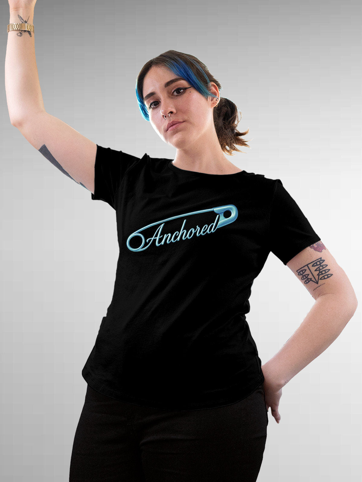 Model wearing Women's Black Round Neck T-shirt with 'Anchored' design, offering effortless style and premium comfort