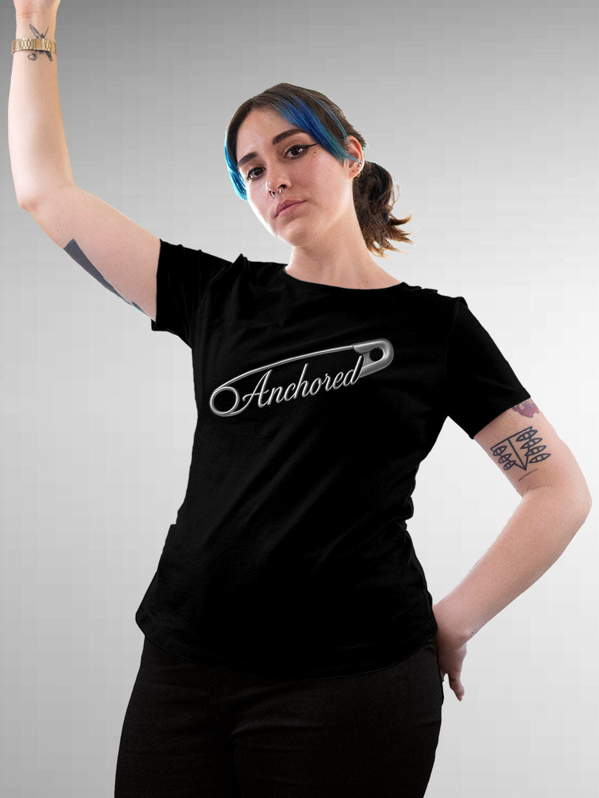 Model wearing Women's Black Round Neck T-shirt with 'Anchored' design, offering effortless style and premium comfort