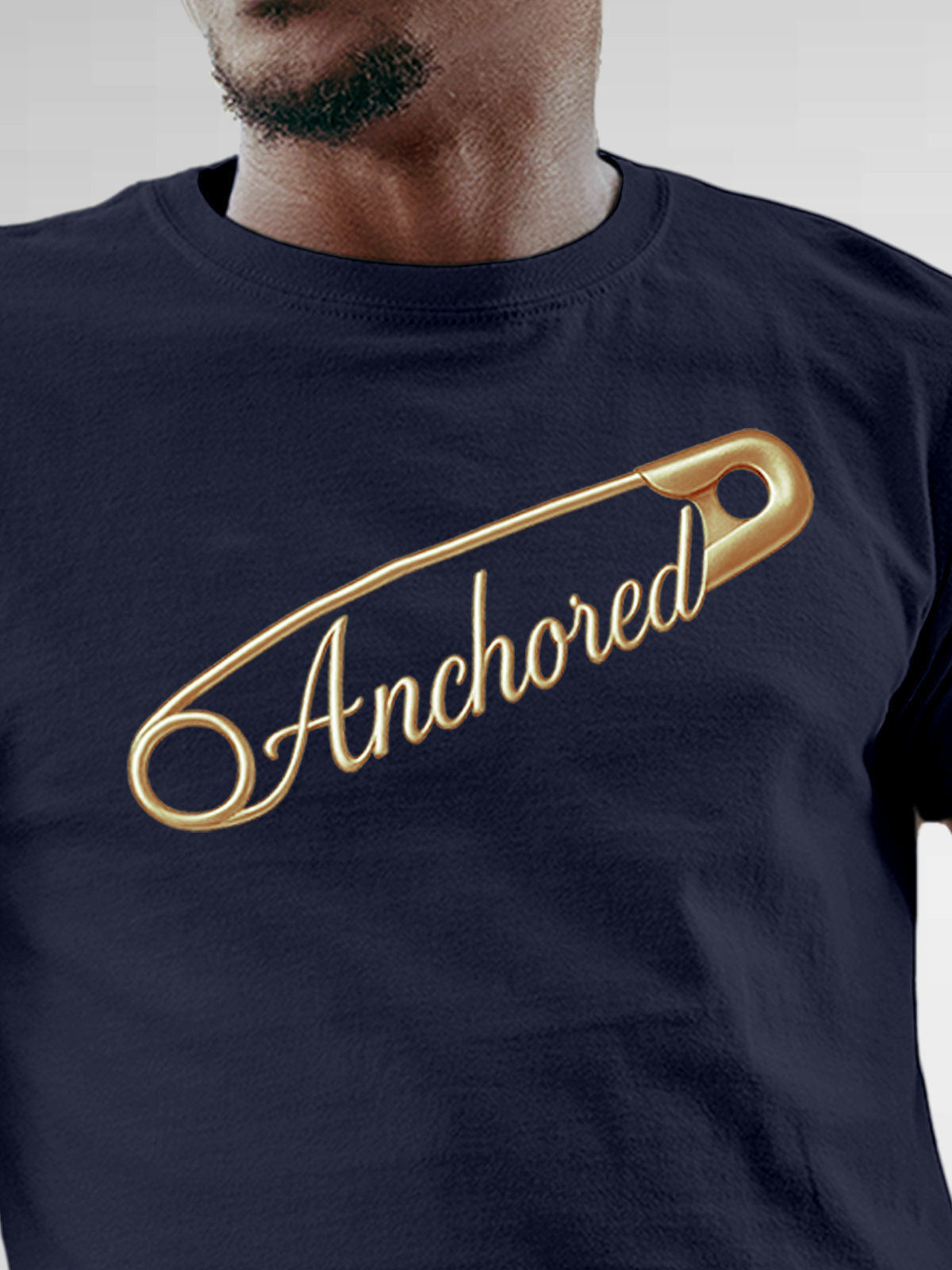 Close up of 'Anchored' design on Men's Navy Blue Round Neck T-shirt, highlighting intricate details and vibrant print.