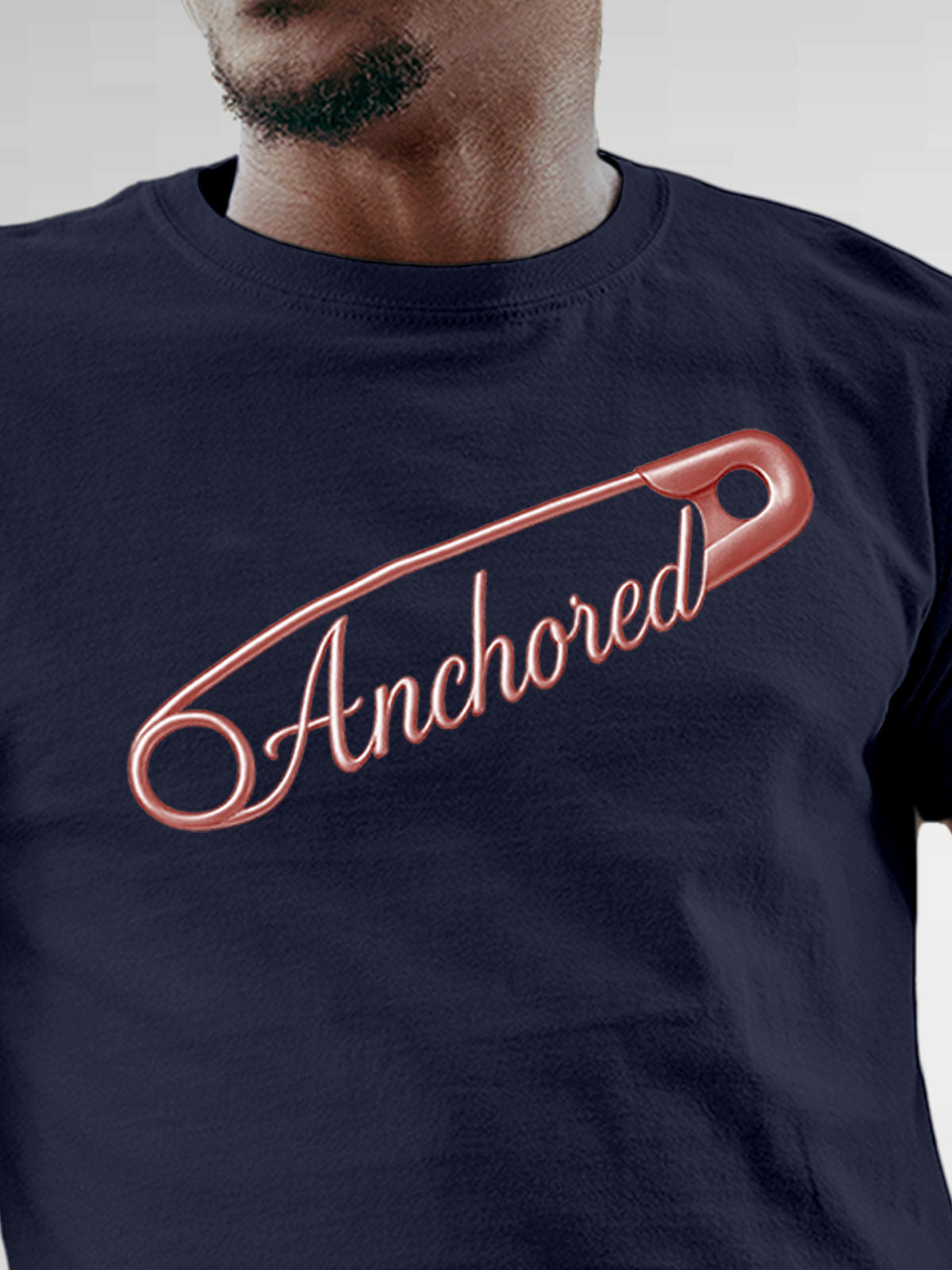 Close up of 'Anchored' design on Men's Navy Blue Round Neck T-shirt, highlighting intricate details and vibrant print.