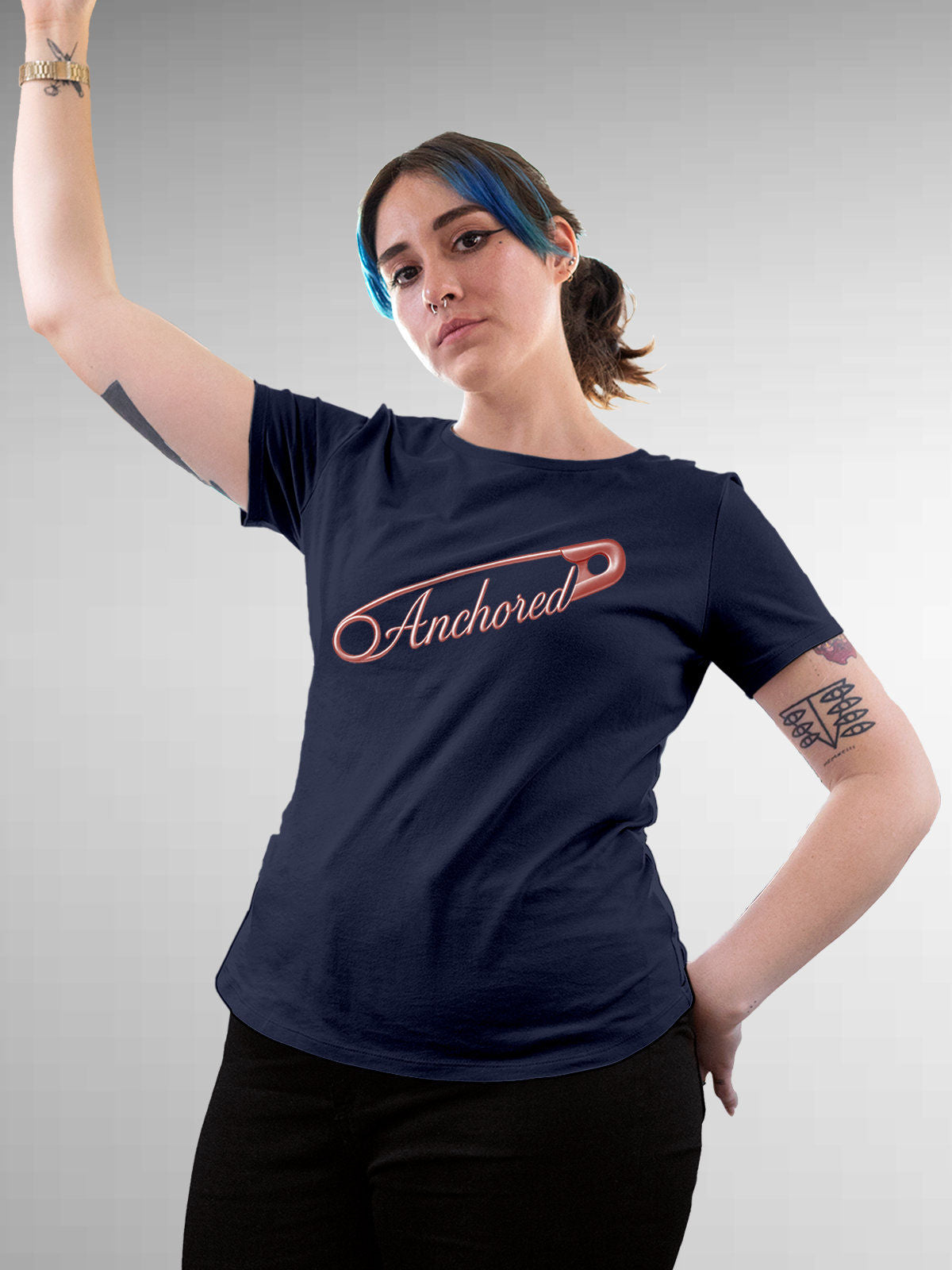 Model wearing Women's Navy Blue Round Neck T-shirt with 'Anchored' design, offering effortless style and premium comfort