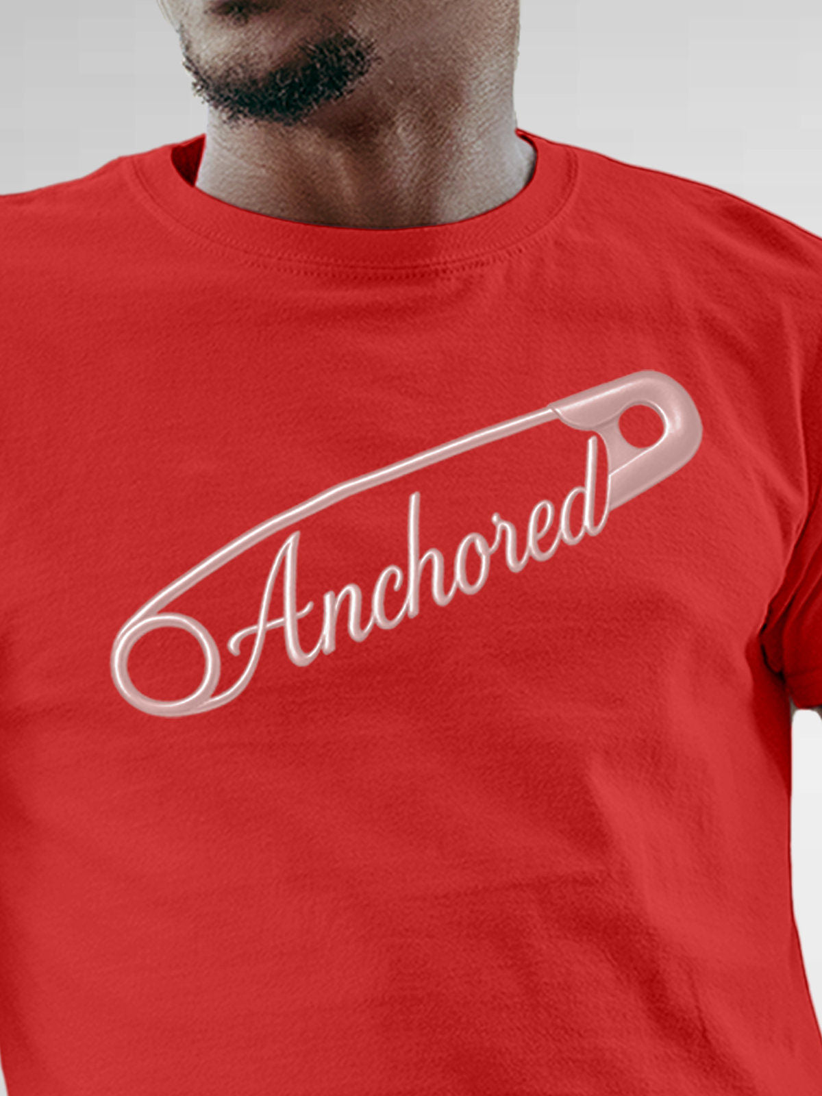 Close up of 'Anchored' design on Men's Red Round Neck T-shirt, highlighting intricate details and vibrant print.