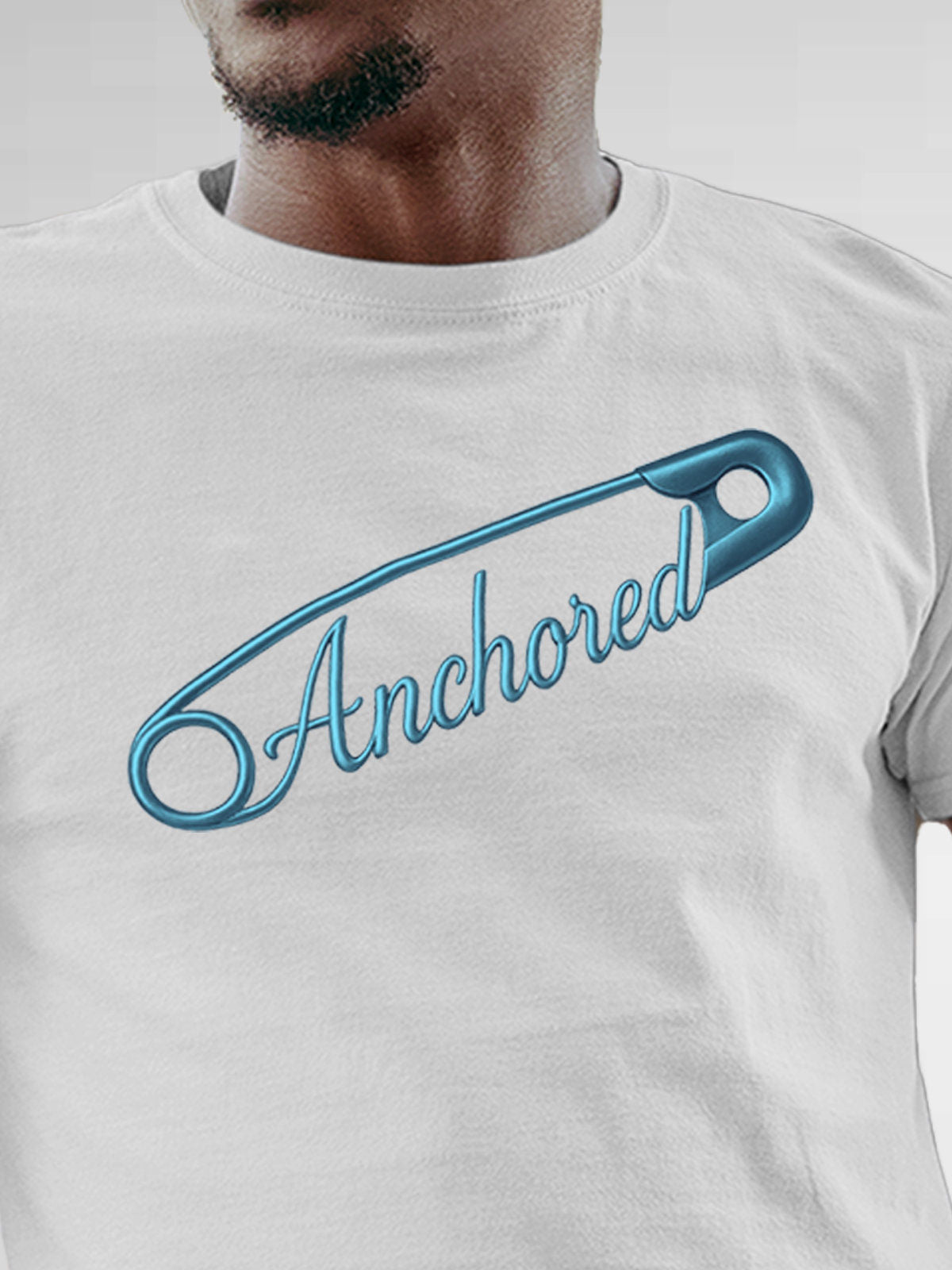 Close up of 'Anchored' design on Men's White Round Neck T-shirt, highlighting intricate details and vibrant print.