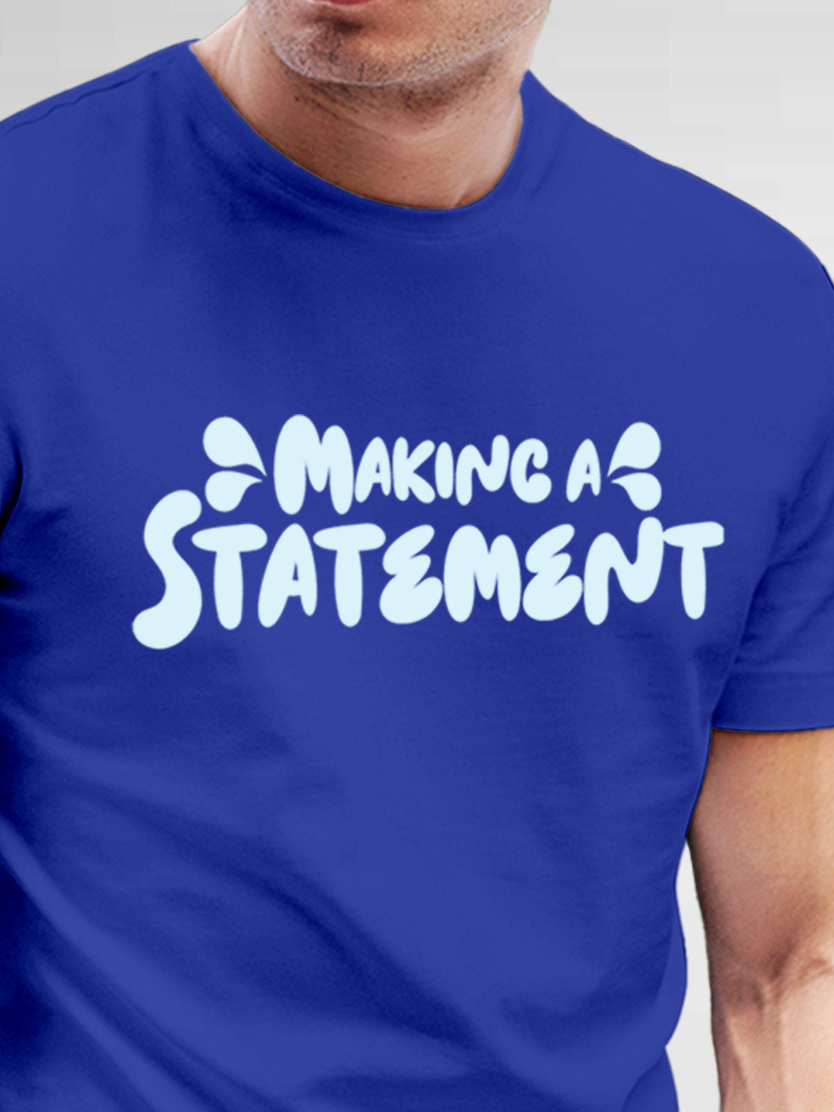 Close up of 'Making A Statement' design on Men's Blue Round Neck T-shirt, highlighting intricate details and vibrant print.