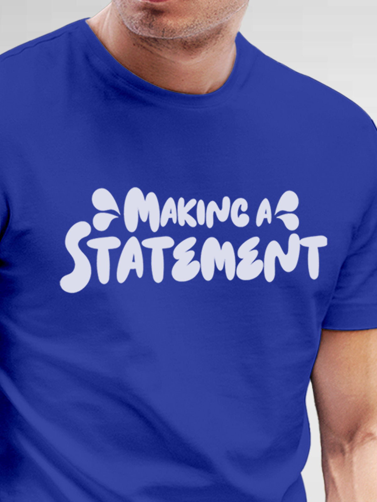 Close up of 'Making A Statement' design on Men's Blue Round Neck T-shirt, highlighting intricate details and vibrant print.