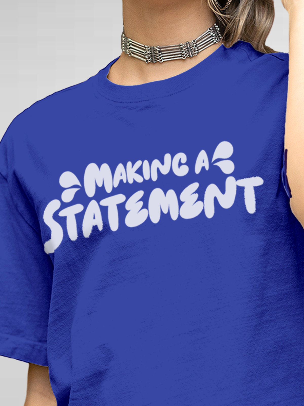 Close up of 'Making A Statement' design on Women's Blue Round Neck T-shirt, highlighting intricate details and vibrant print.