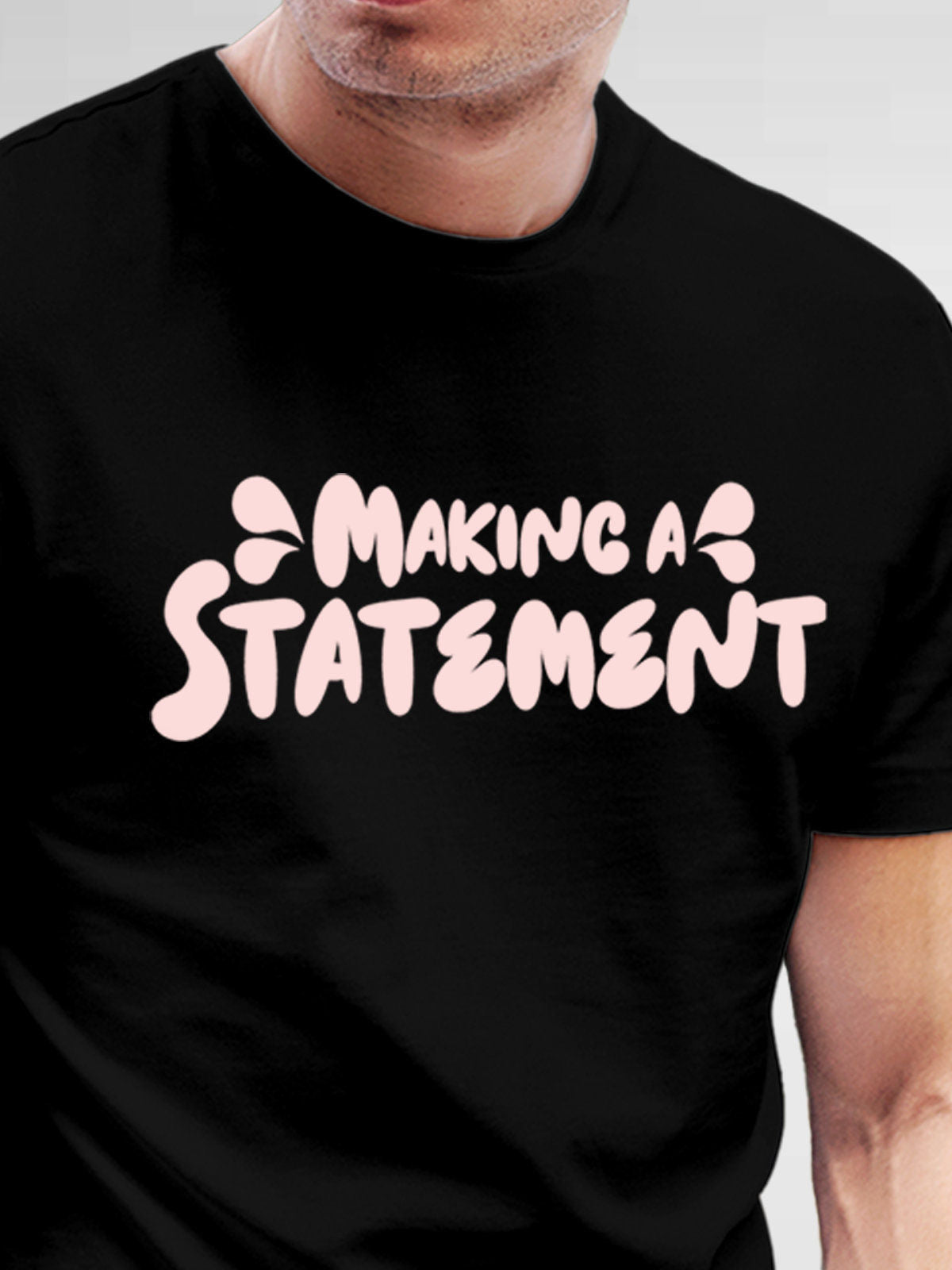 Close up of 'Making A Statement' design on Men's Black Round Neck T-shirt, highlighting intricate details and vibrant print.