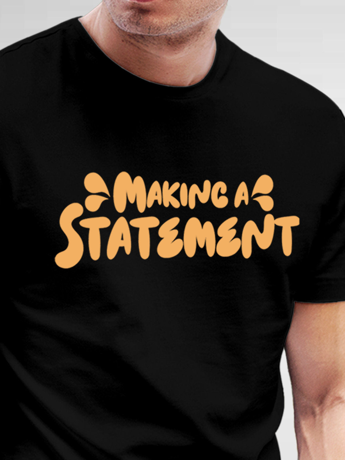Close up of 'Making A Statement' design on Men's Black Round Neck T-shirt, highlighting intricate details and vibrant print.