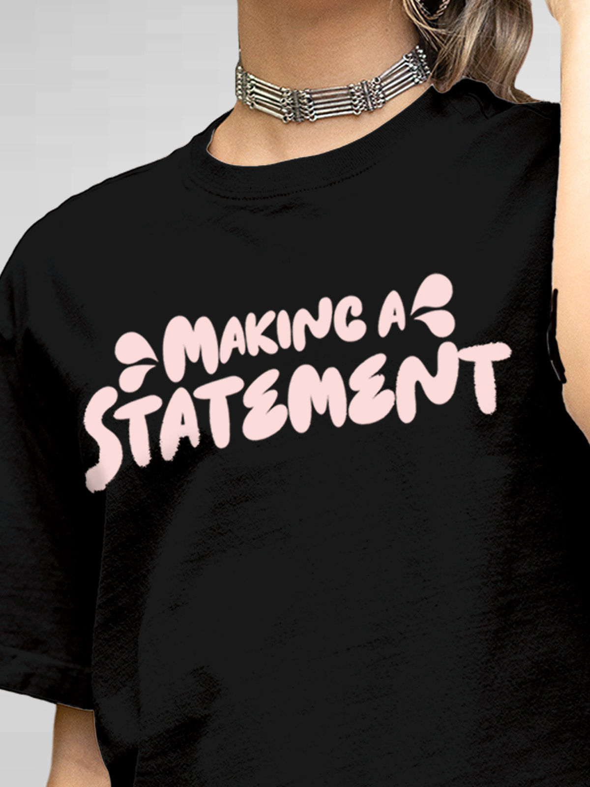 Close up of 'Making A Statement' design on Women's Black Round Neck T-shirt, highlighting intricate details and vibrant print.