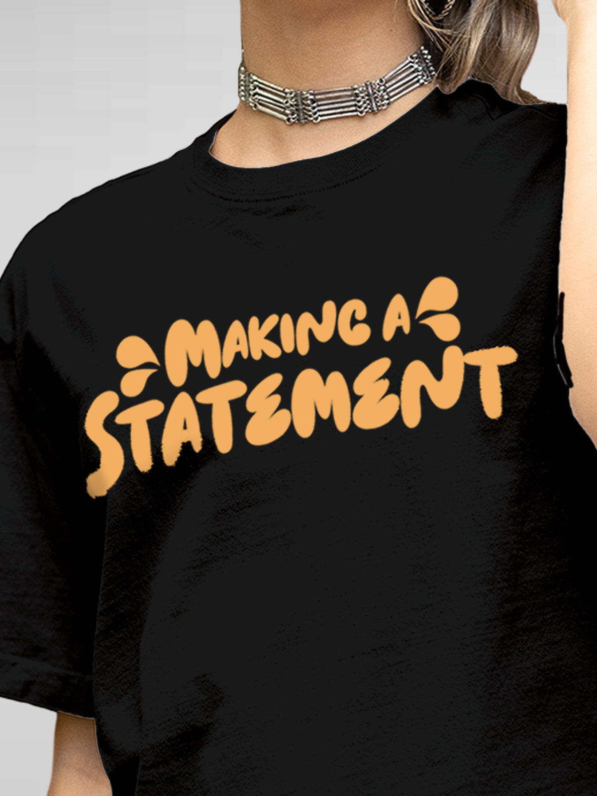 Close up of 'Making A Statement' design on Women's Black Round Neck T-shirt, highlighting intricate details and vibrant print.