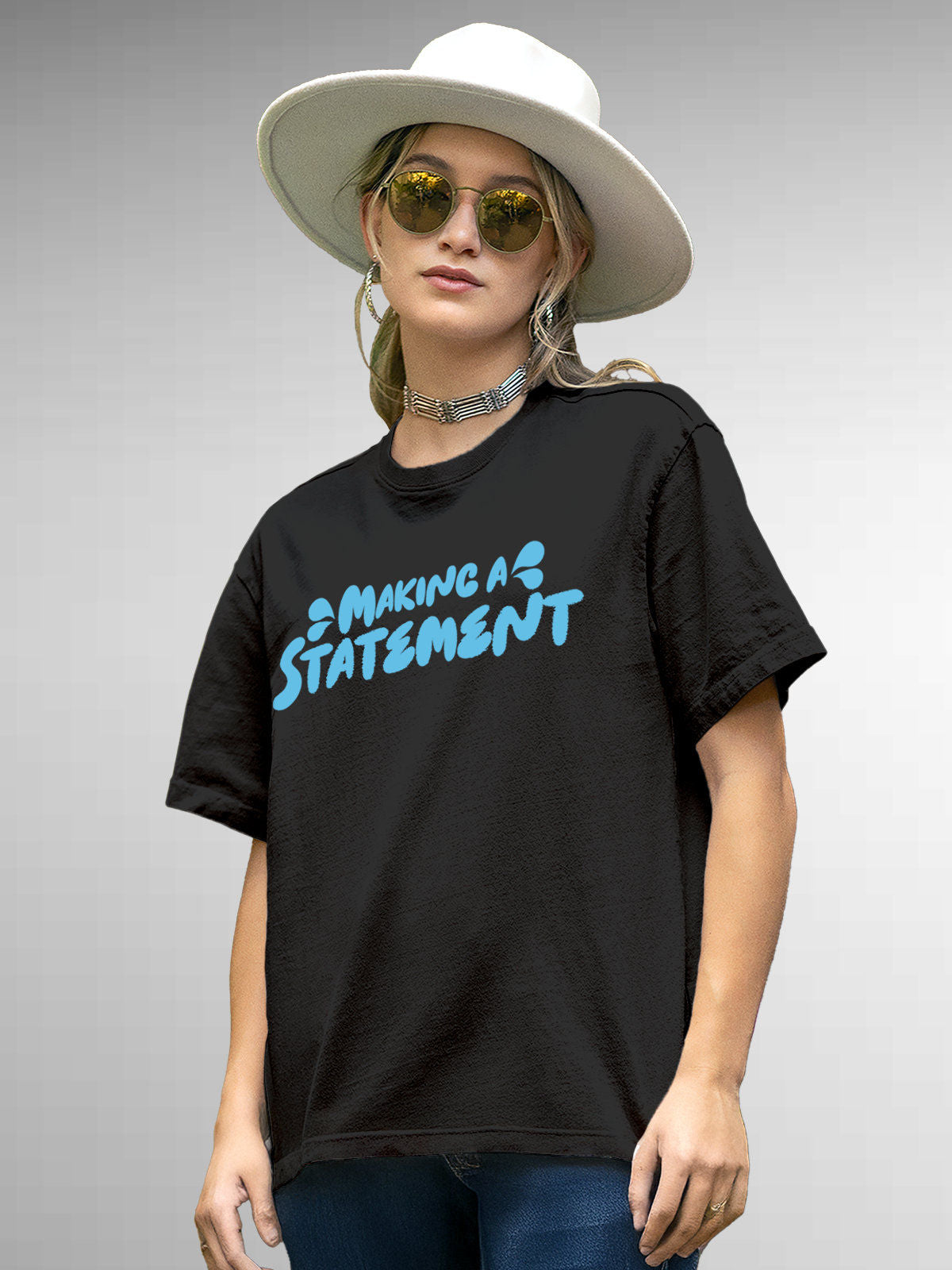 Model wearing Women's Dark Grey Round Neck T-shirt with 'Making A Statement' design, offering effortless style and premium comfort