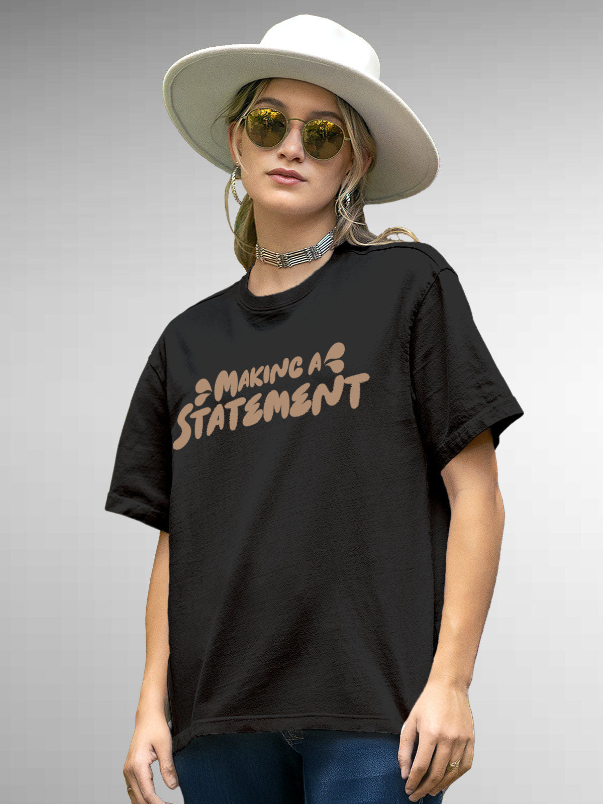 Model wearing Women's Dark Grey Round Neck T-shirt with 'Making A Statement' design, offering effortless style and premium comfort