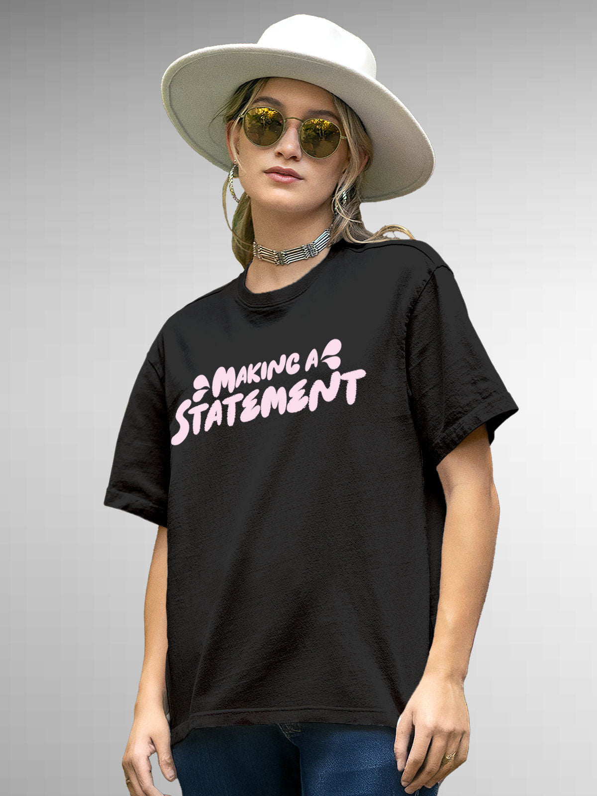 Model wearing Women's Dark Grey Round Neck T-shirt with 'Making A Statement' design, offering effortless style and premium comfort