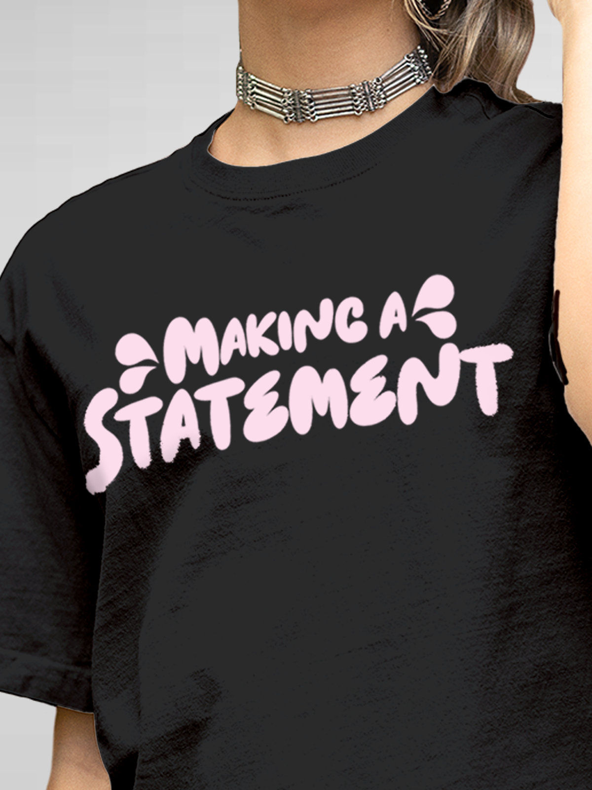 Close up of 'Making A Statement' design on Women's Dark Grey Round Neck T-shirt, highlighting intricate details and vibrant print.