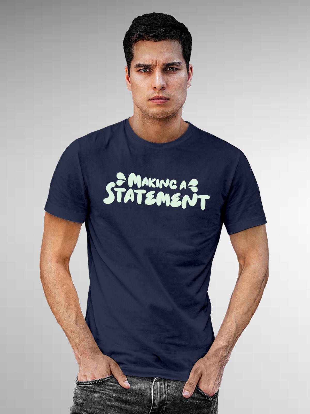 Model wearing Men's Navy Blue Round Neck T-shirt with 'Making A Statement' design, offering effortless style and premium comfort