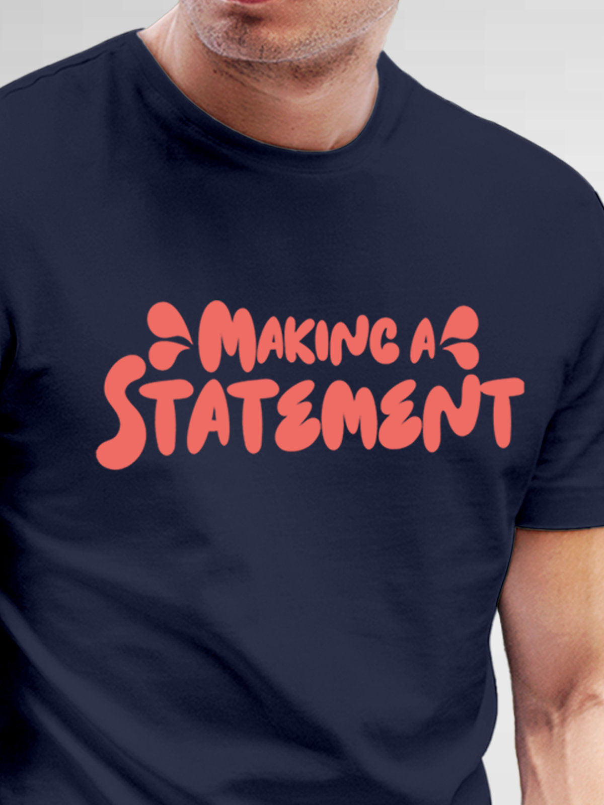 Close up of 'Making A Statement' design on Men's Navy Blue Round Neck T-shirt, highlighting intricate details and vibrant print.