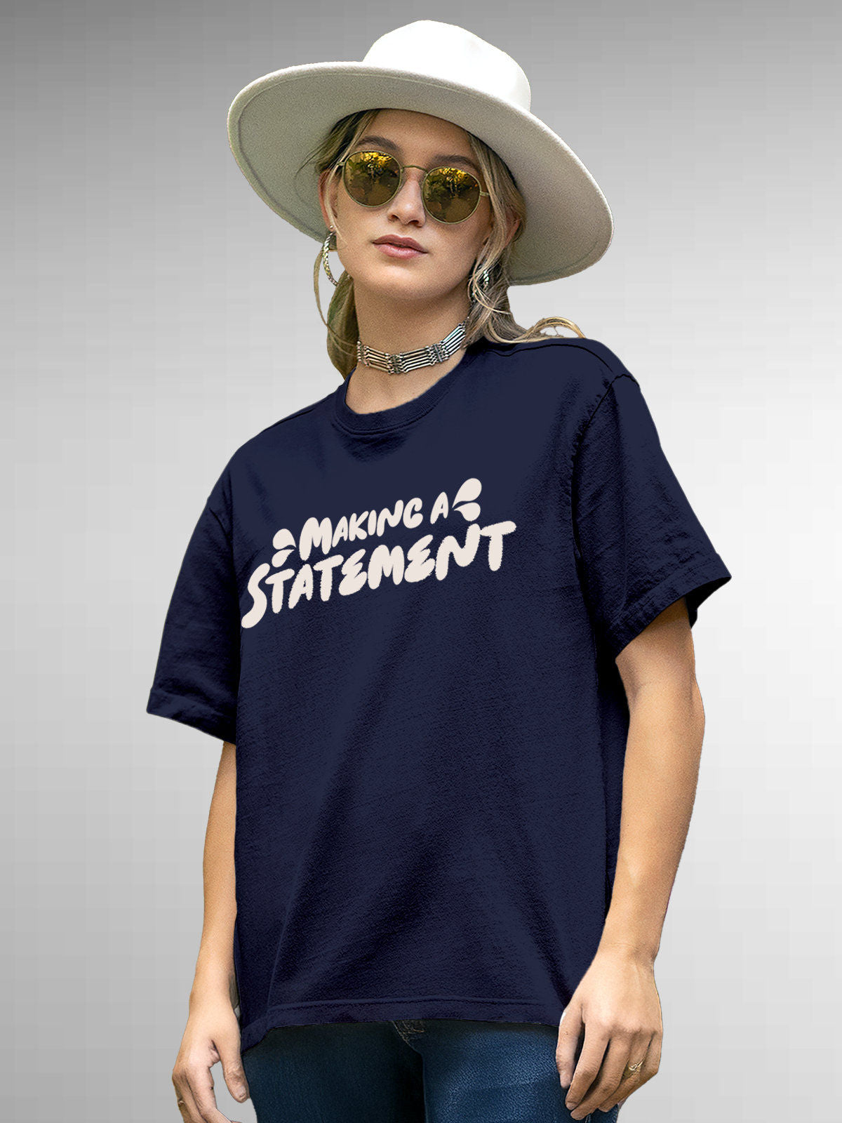 Model wearing Women's Navy Blue Round Neck T-shirt with 'Making A Statement' design, offering effortless style and premium comfort