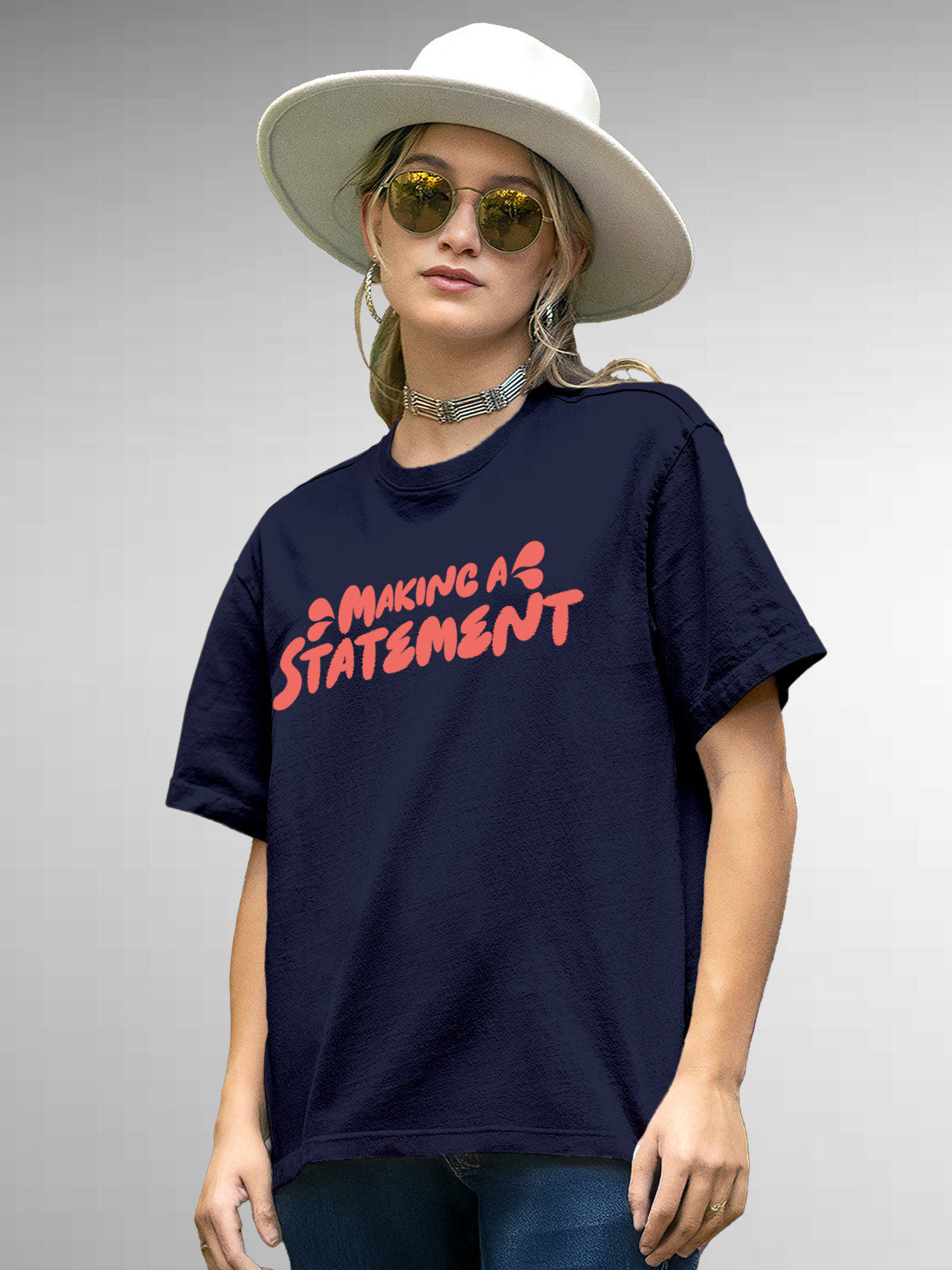 Model wearing Women's Navy Blue Round Neck T-shirt with 'Making A Statement' design, offering effortless style and premium comfort