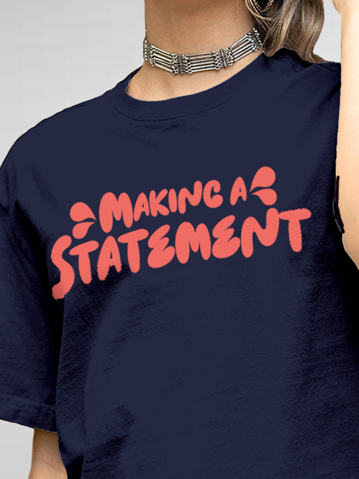 Close up of 'Making A Statement' design on Women's Navy Blue Round Neck T-shirt, highlighting intricate details and vibrant print.