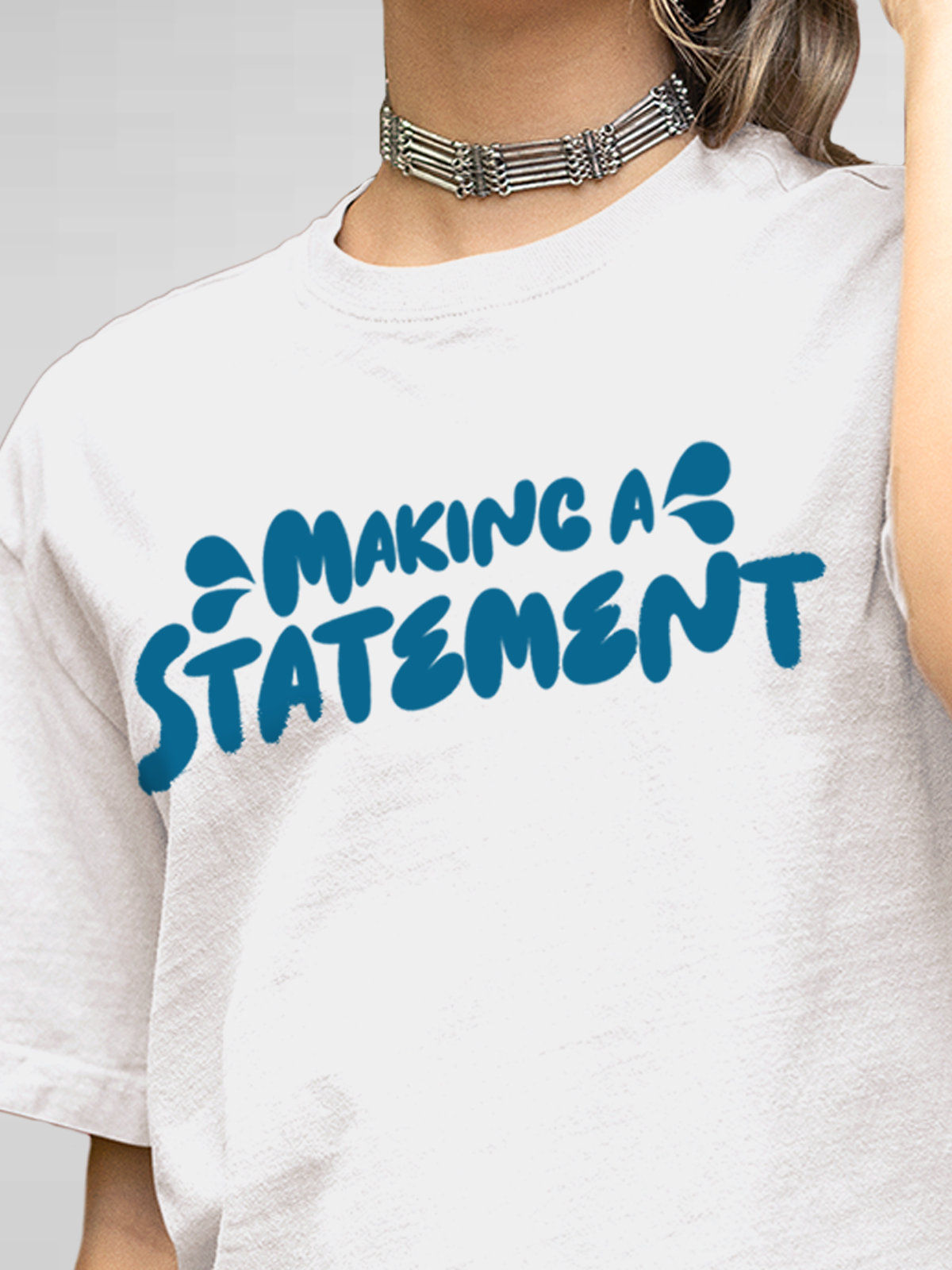 Close up of 'Making A Statement' design on Women's White Round Neck T-shirt, highlighting intricate details and vibrant print.