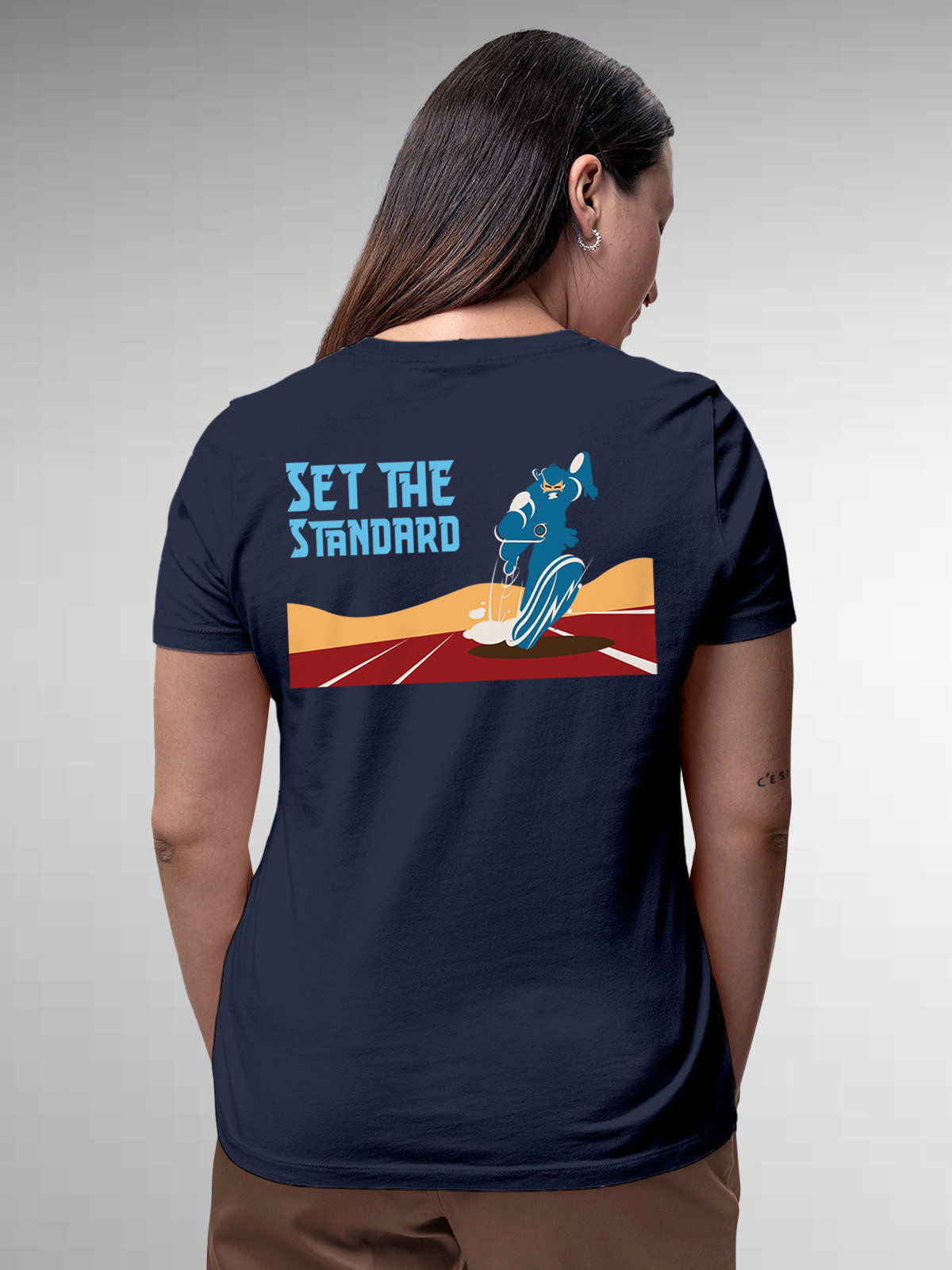 Model wearing Women's Navy Blue Round Neck T-shirt with 'Set The Standard' design, offering effortless style and premium comfort