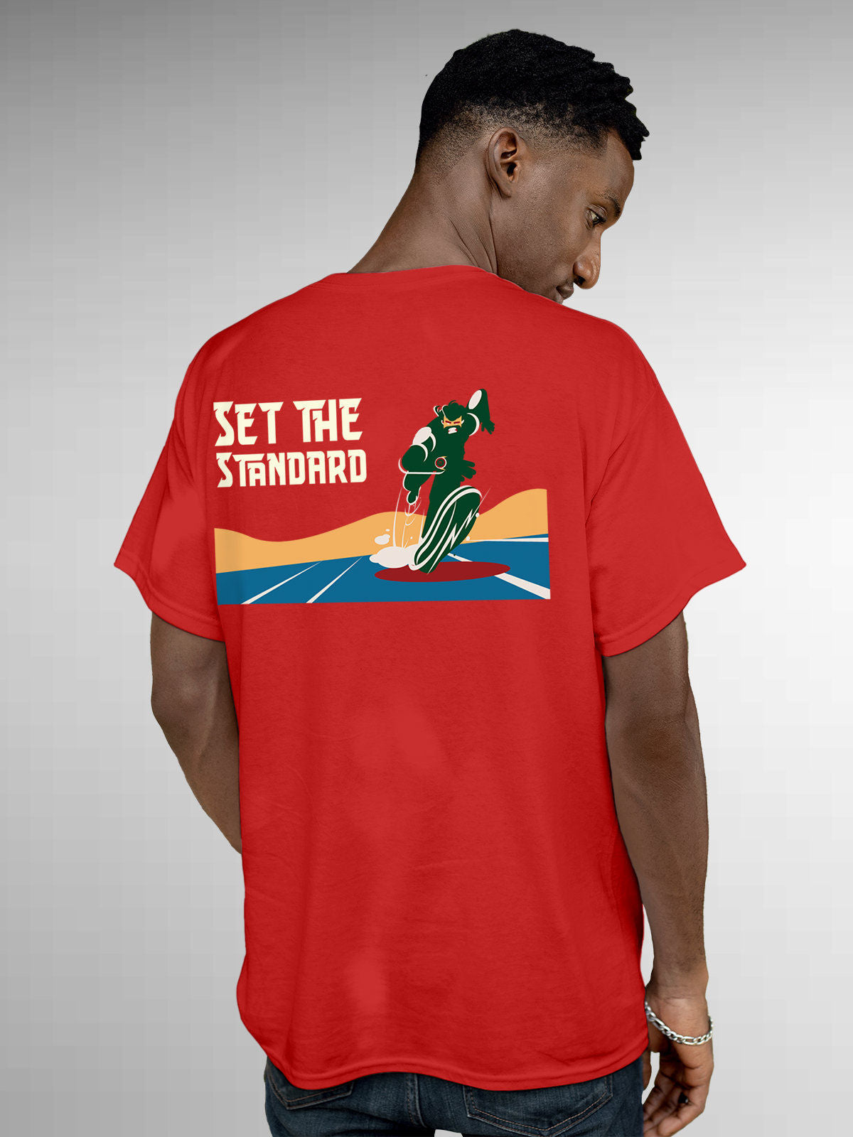 Model wearing Men's Red Round Neck T-shirt with 'Set The Standard' design, offering effortless style and premium comfort