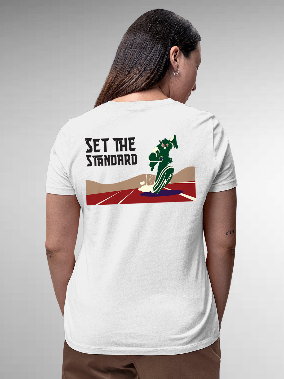 Model wearing Women's White Round Neck T-shirt with 'Set The Standard' design, offering effortless style and premium comfort