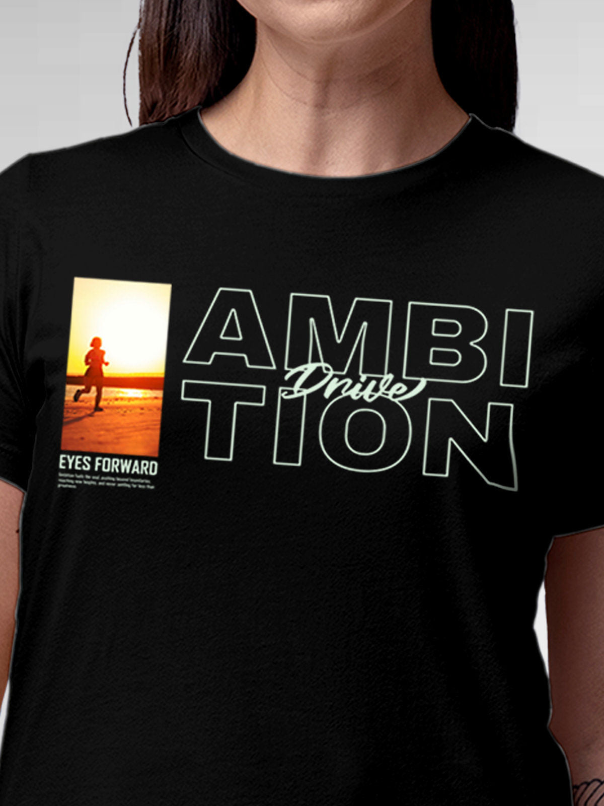 Close up of 'Ambition & Drive' design on Women's Black Round Neck T-shirt, highlighting intricate details and vibrant print.