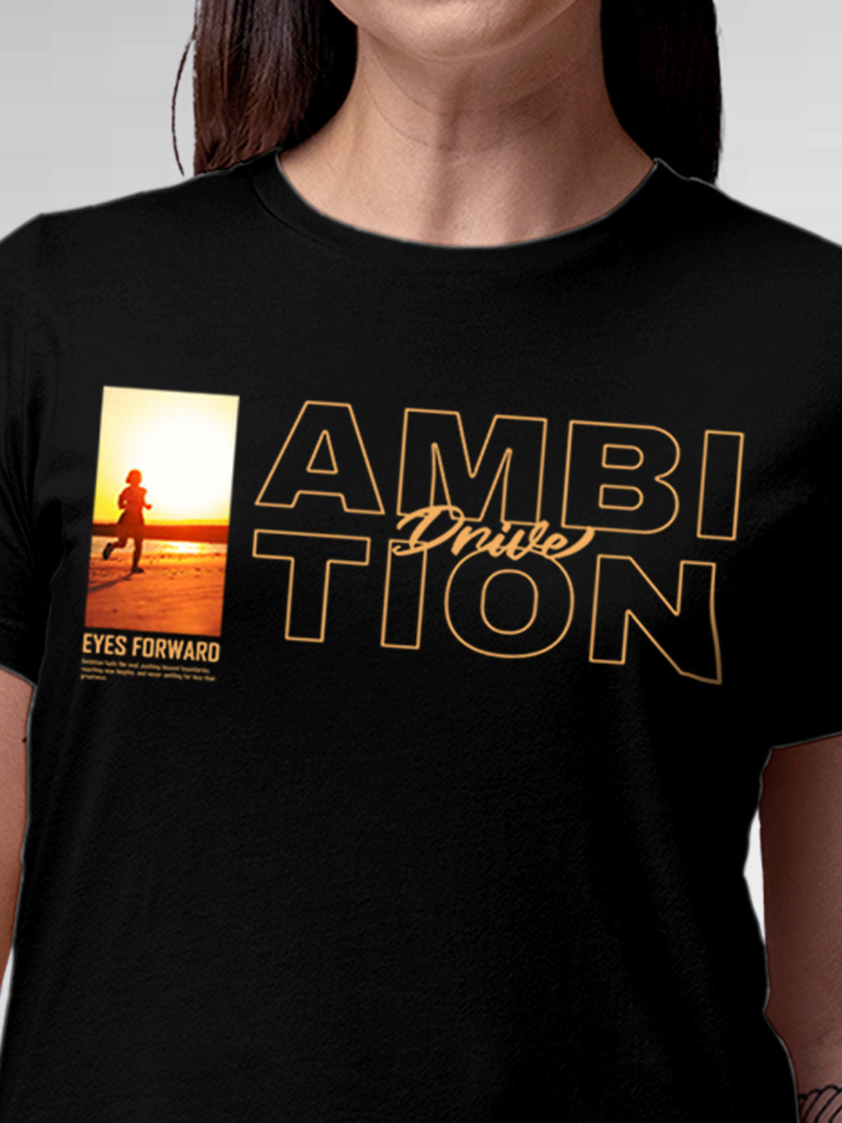 Close up of 'Ambition & Drive' design on Women's Black Round Neck T-shirt, highlighting intricate details and vibrant print.