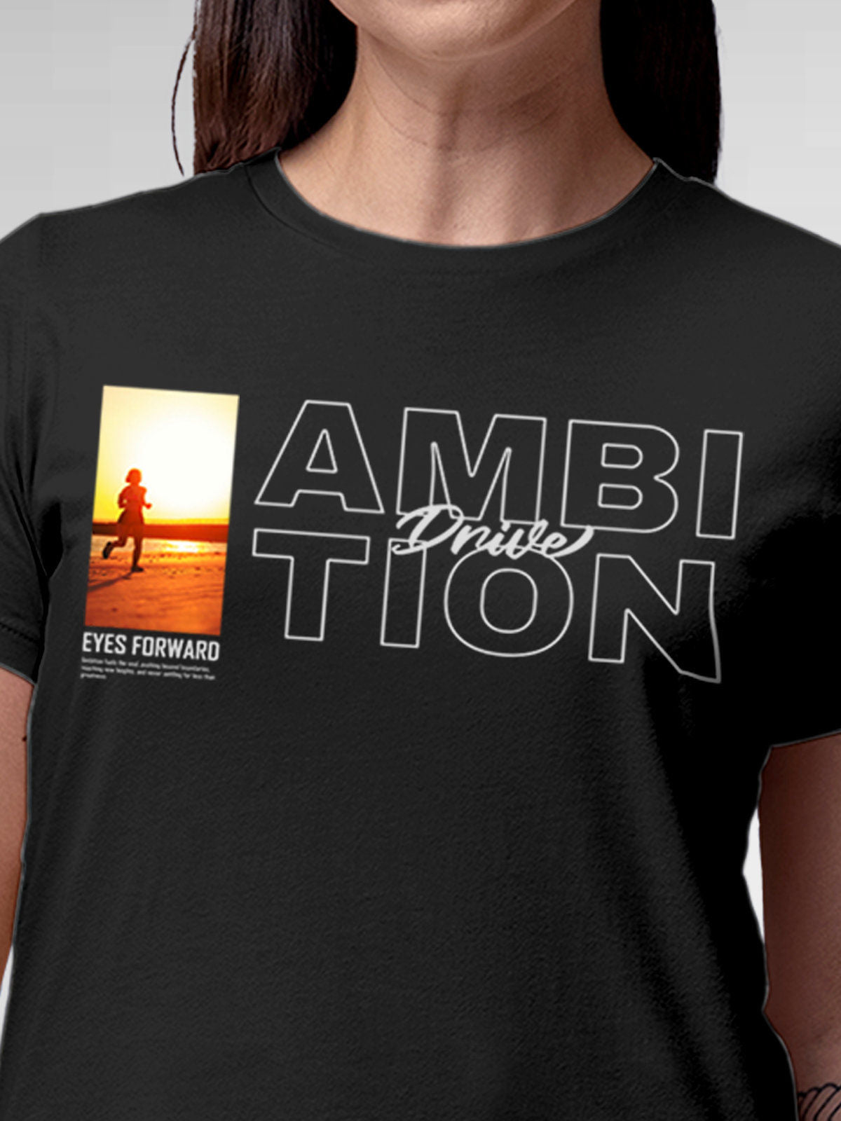 Close up of 'Ambition & Drive' design on Women's Dark Grey Round Neck T-shirt, highlighting intricate details and vibrant print.
