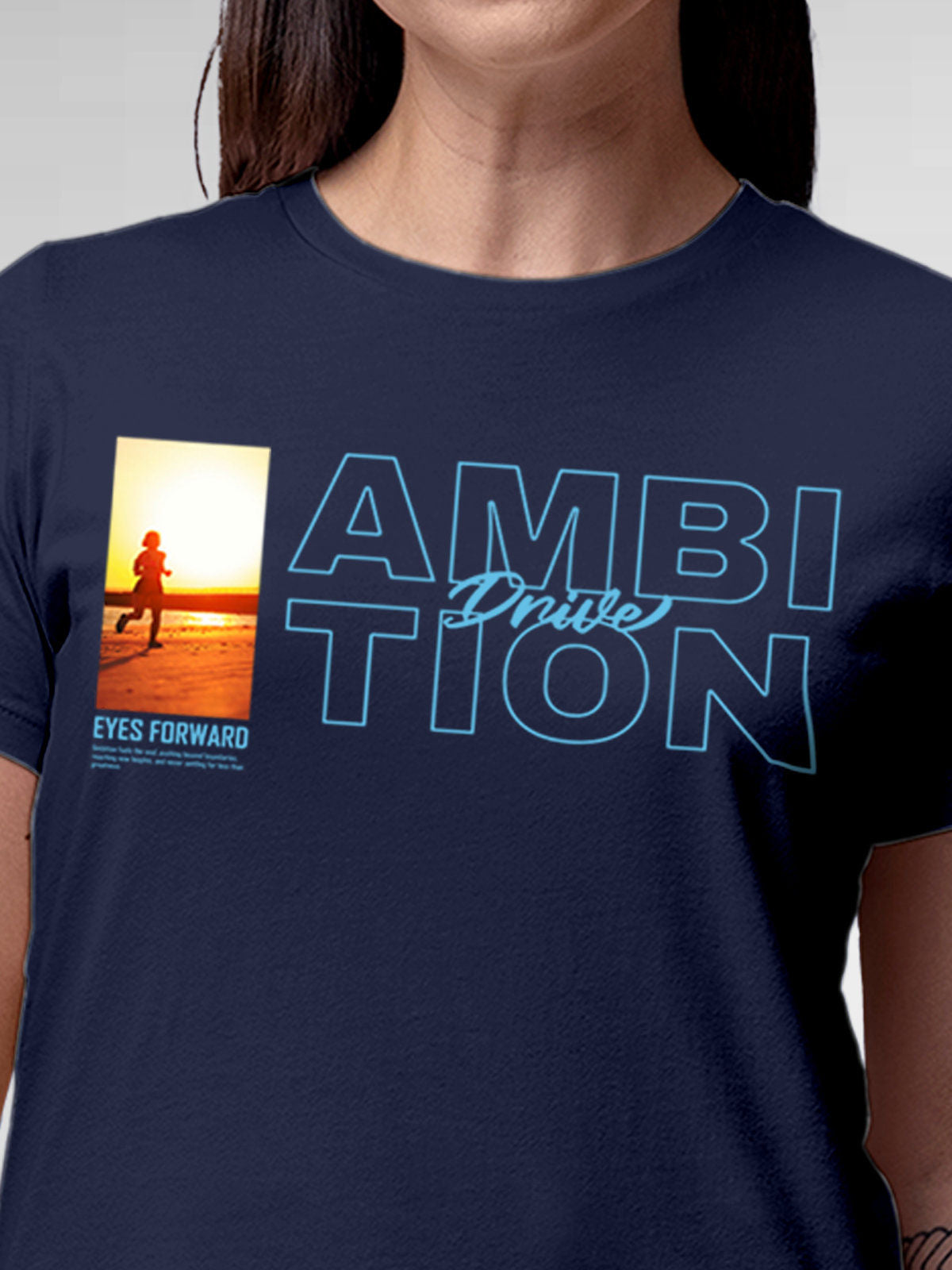 Close up of 'Ambition & Drive' design on Women's Navy Blue Round Neck T-shirt, highlighting intricate details and vibrant print.