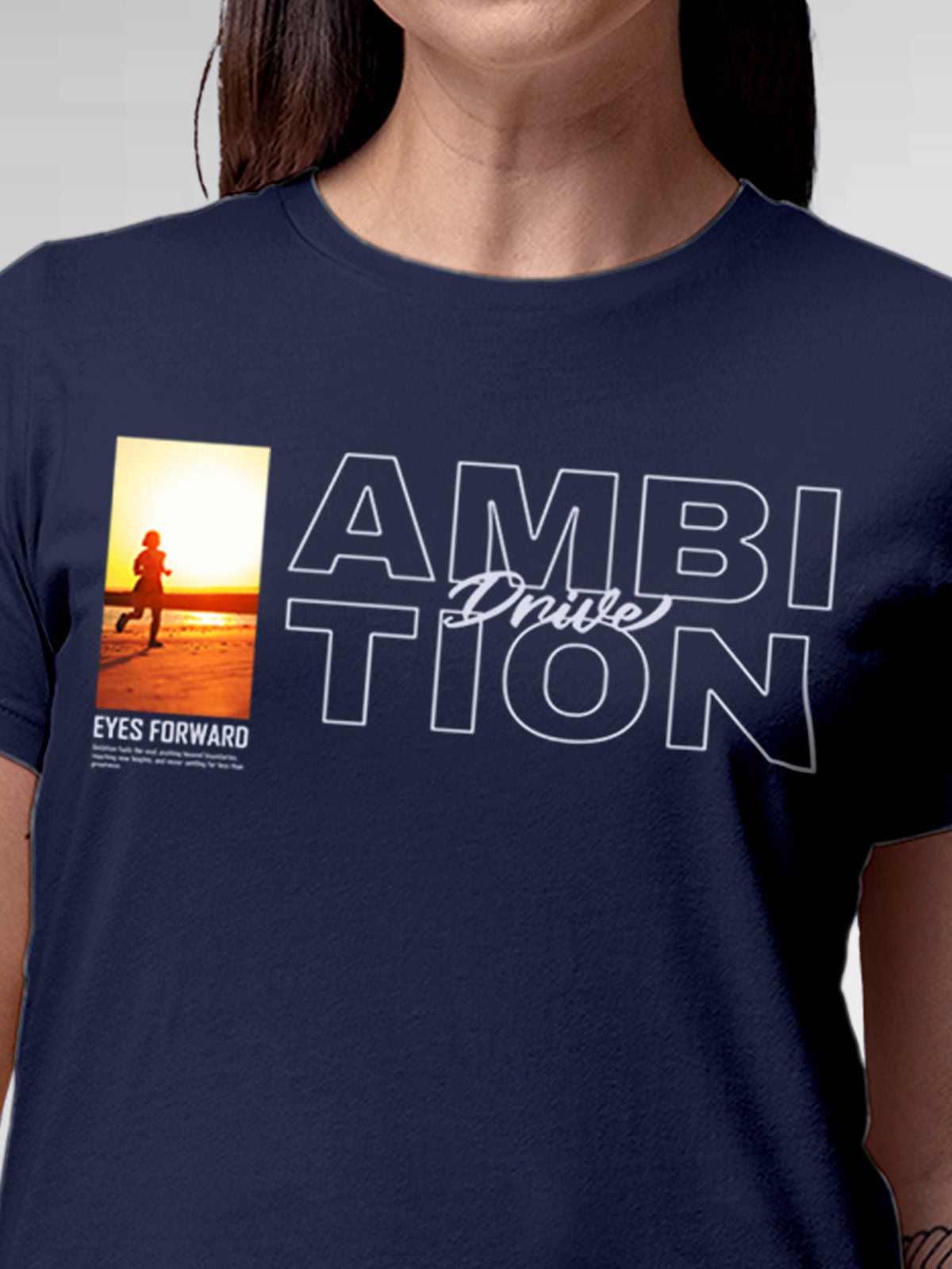 Close up of 'Ambition & Drive' design on Women's Navy Blue Round Neck T-shirt, highlighting intricate details and vibrant print.