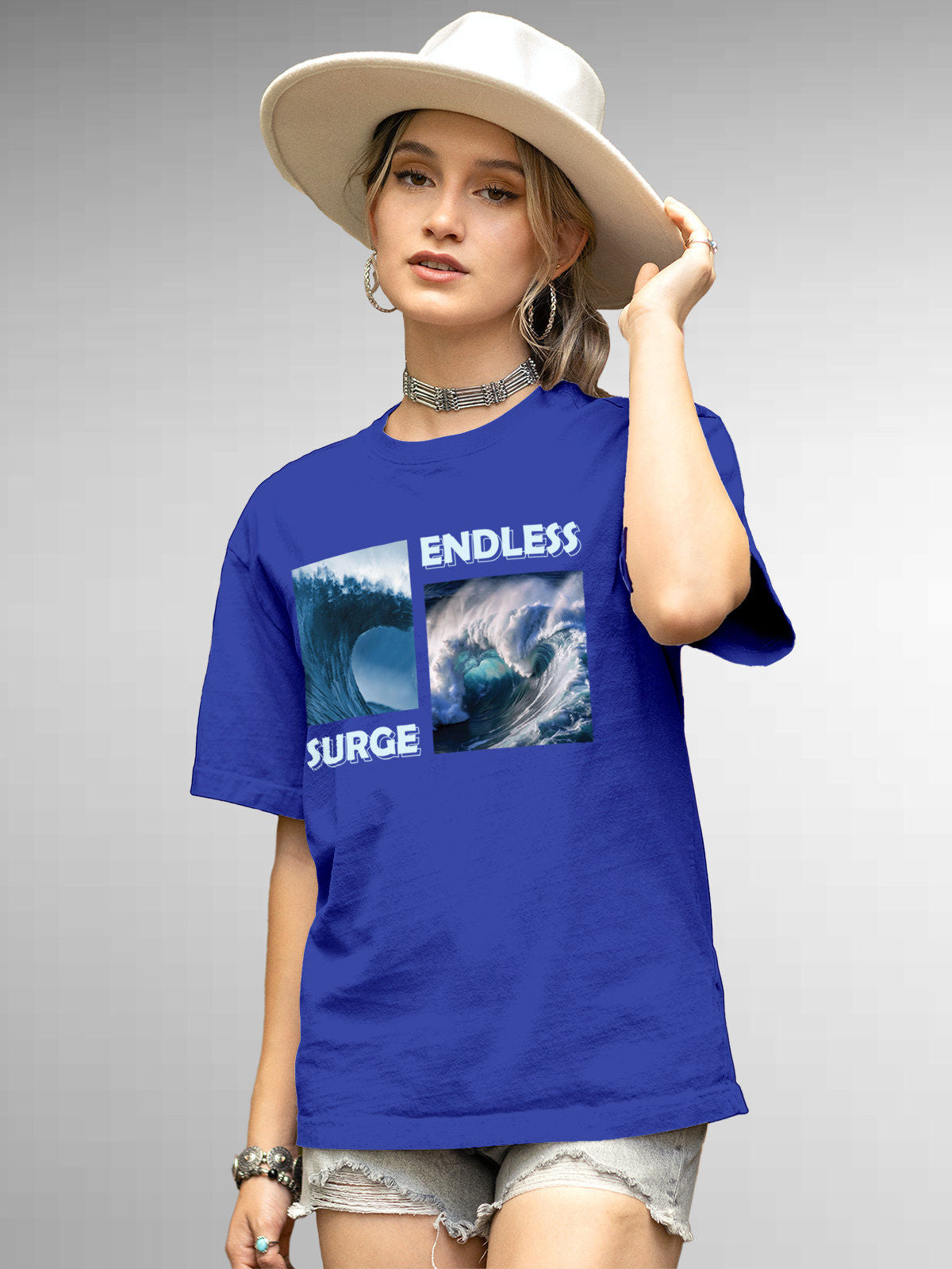 Model wearing Women's Blue Round Neck T-shirt with 'Endless Surge' design, offering effortless style and premium comfort