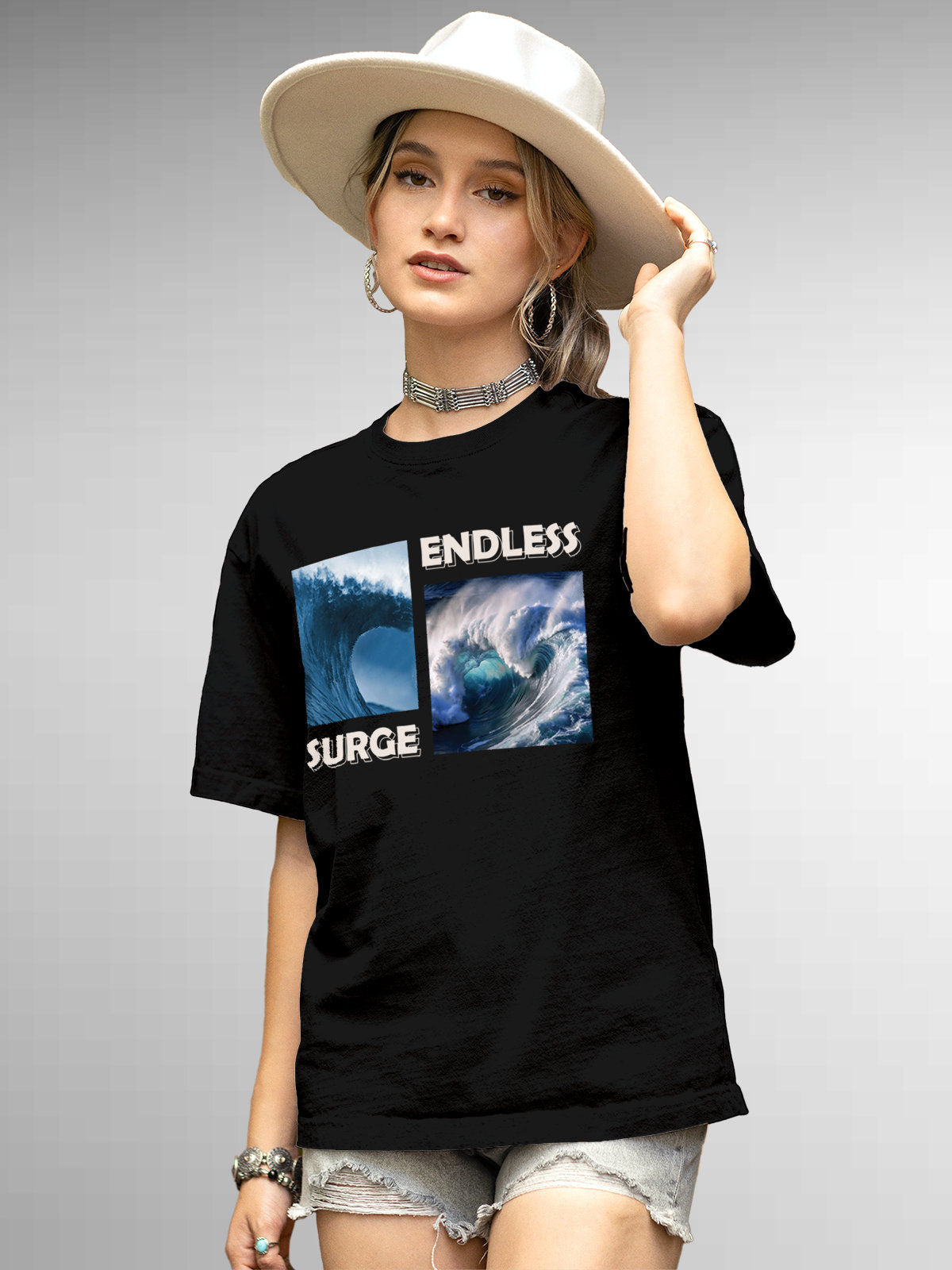Model wearing Women's Black Round Neck T-shirt with 'Endless Surge' design, offering effortless style and premium comfort