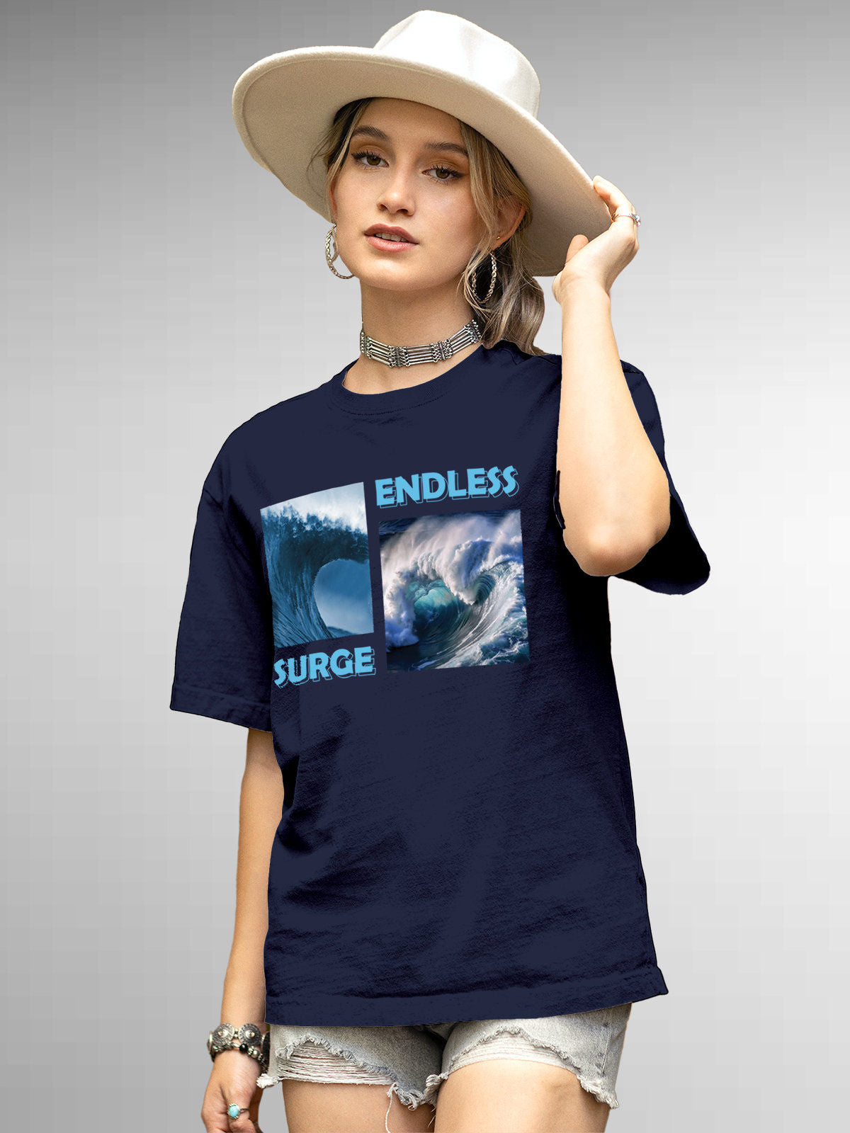 Model wearing Women's Navy Blue Round Neck T-shirt with 'Endless Surge' design, offering effortless style and premium comfort