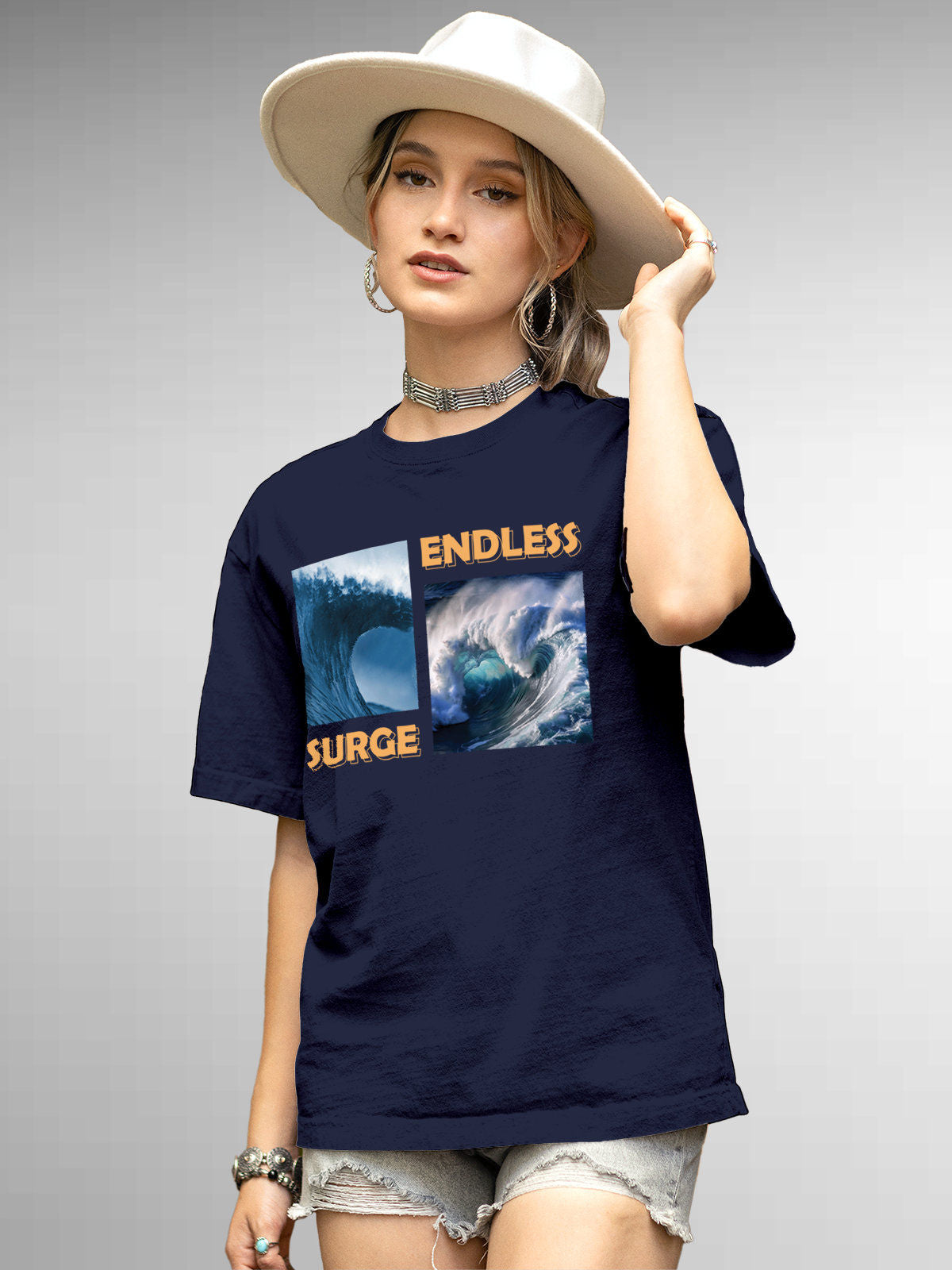 Model wearing Women's Navy Blue Round Neck T-shirt with 'Endless Surge' design, offering effortless style and premium comfort