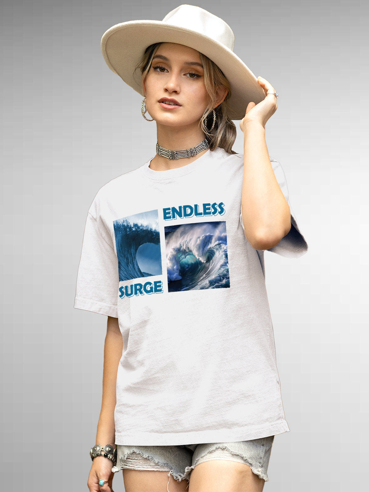 Model wearing Women's White Round Neck T-shirt with 'Endless Surge' design, offering effortless style and premium comfort