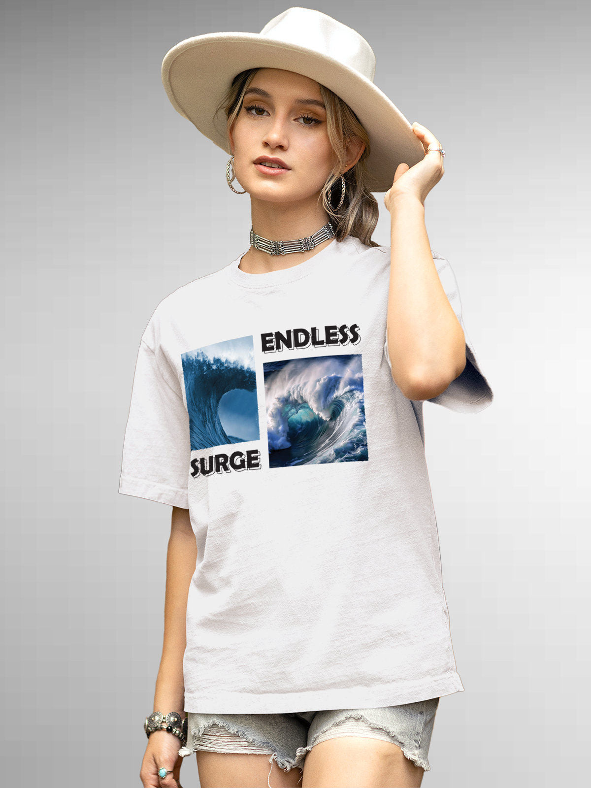 Model wearing Women's White Round Neck T-shirt with 'Endless Surge' design, offering effortless style and premium comfort