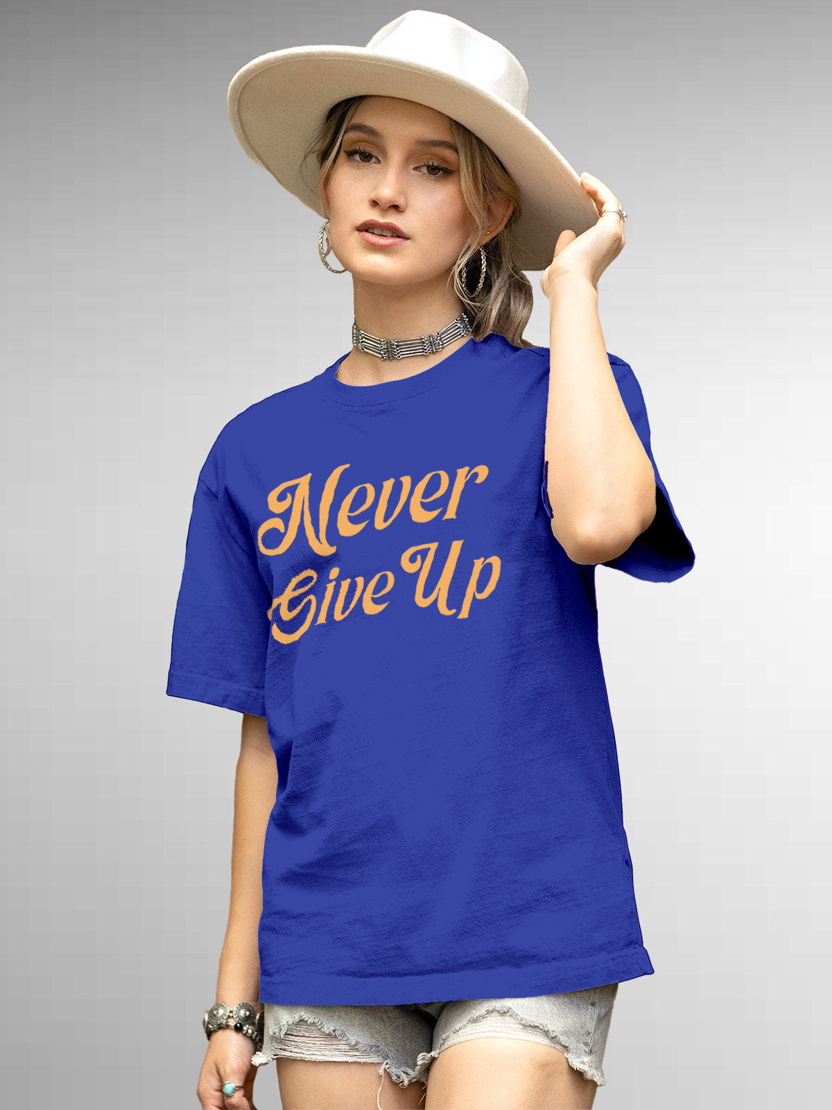 Front view of 'Never Give Up' design on Fighterhero Women's Blue Round Neck T-shirt, highlighting the modern look and clean finish