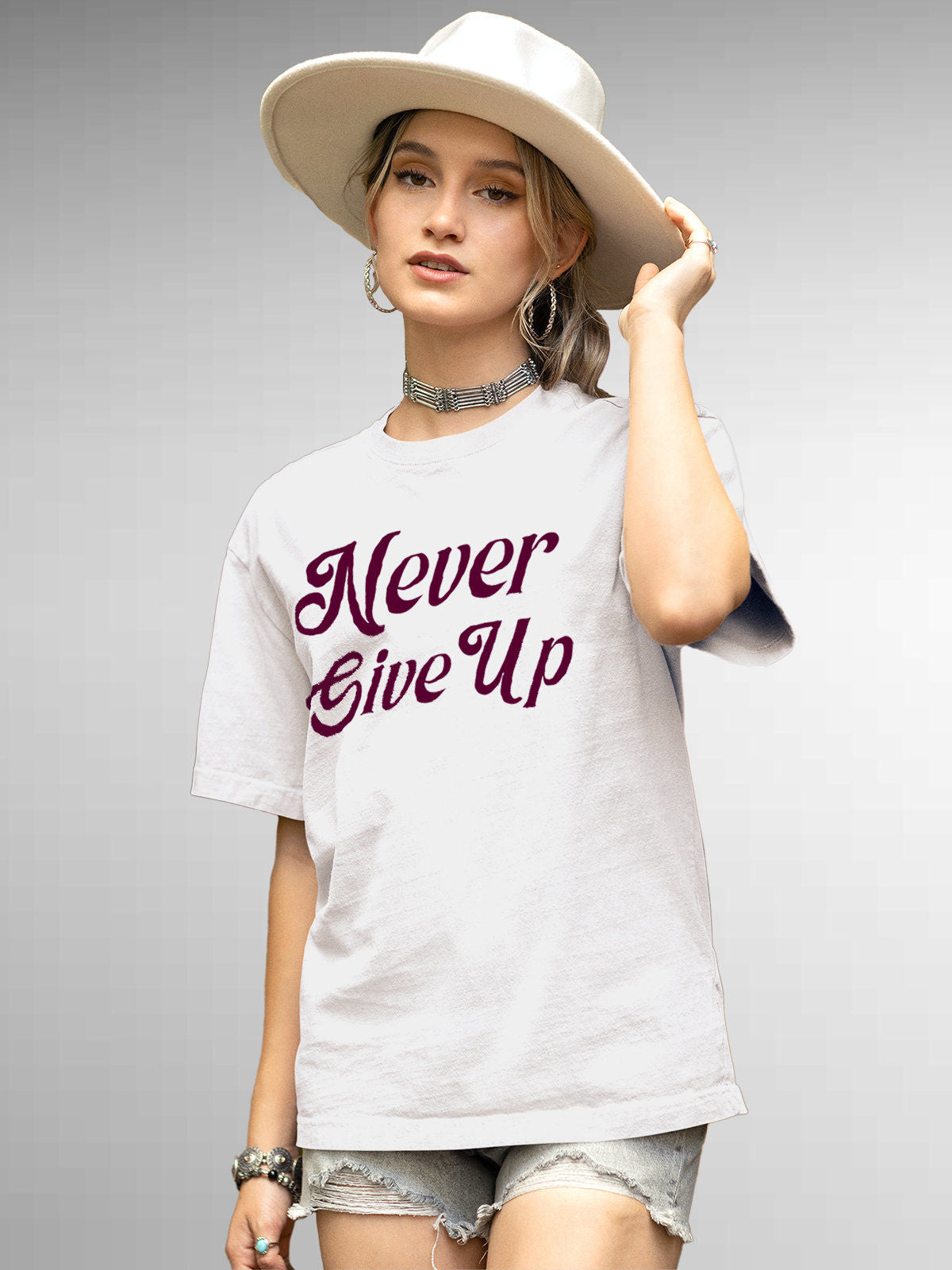 Front view of 'Never Give Up' design on Fighterhero Women's White Round Neck T-shirt, highlighting the modern look and clean finish