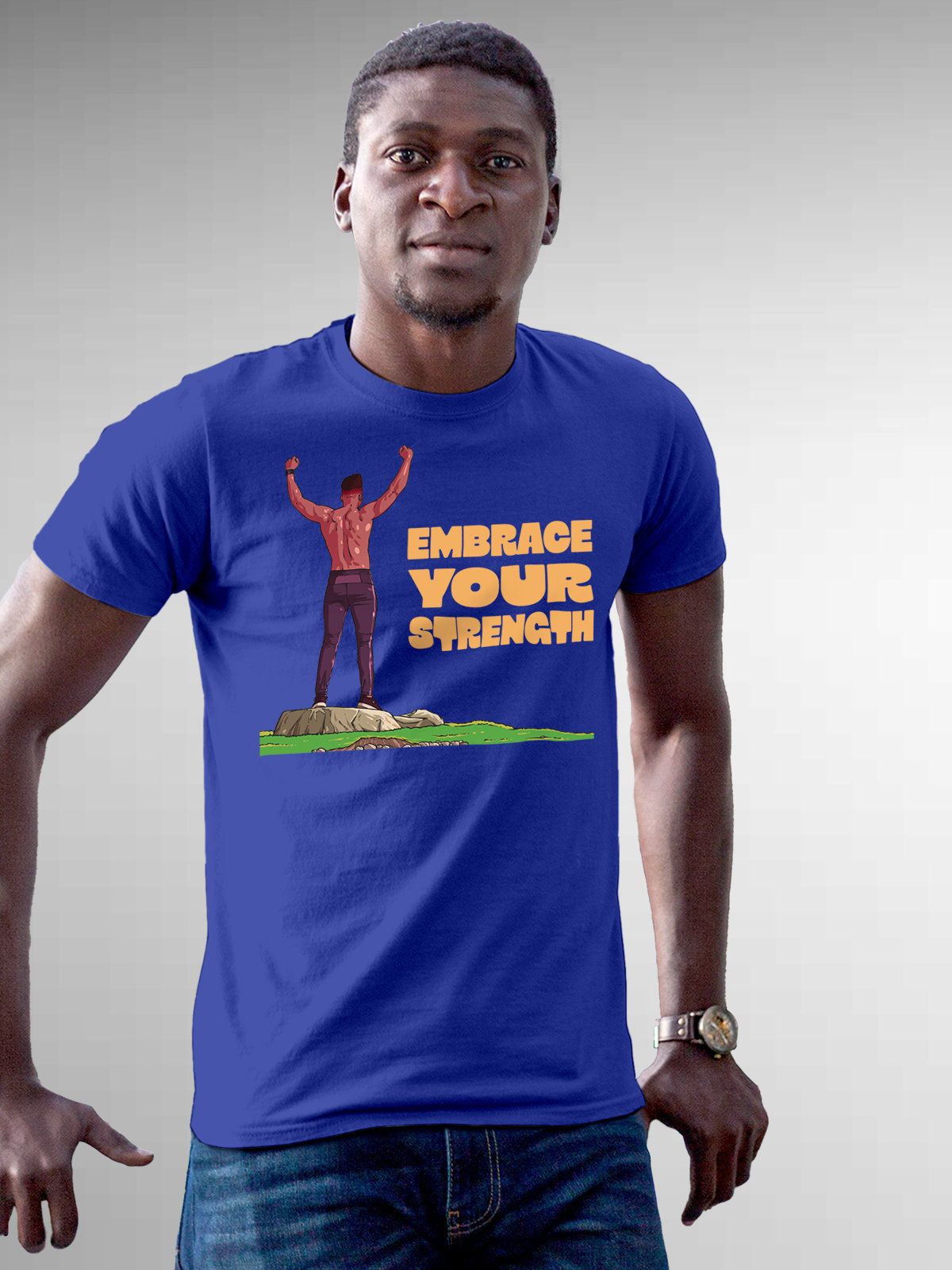 Model wearing Men's Blue Round Neck T-shirt with 'Embrace Your Strength' design, offering effortless style and premium comfort