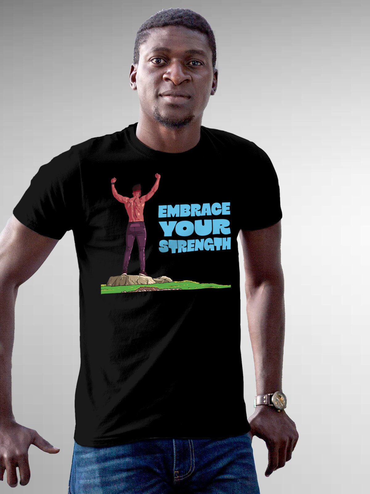 Model wearing Men's Black Round Neck T-shirt with 'Embrace Your Strength' design, offering effortless style and premium comfort