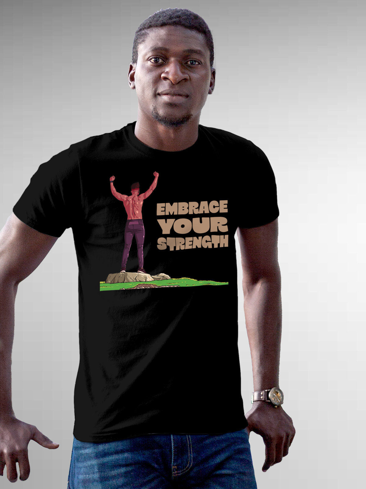 Model wearing Men's Black Round Neck T-shirt with 'Embrace Your Strength' design, offering effortless style and premium comfort