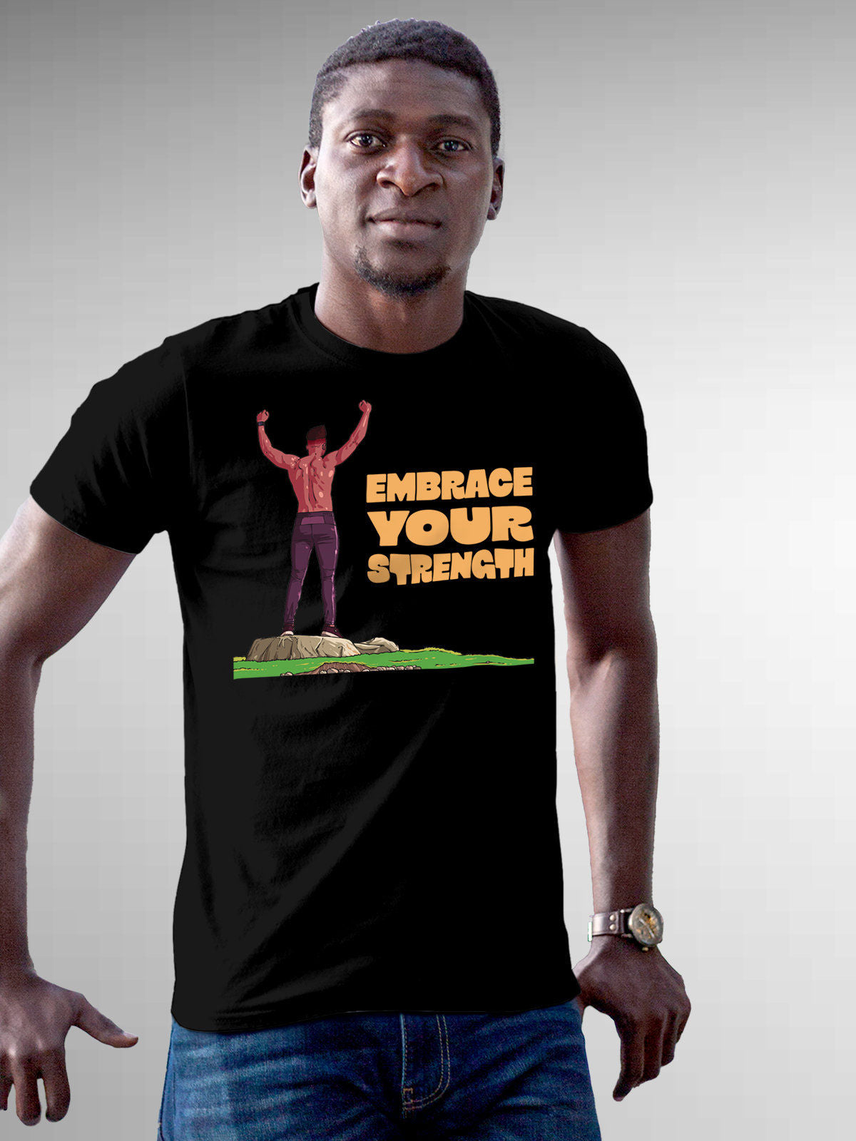 Model wearing Men's Black Round Neck T-shirt with 'Embrace Your Strength' design, offering effortless style and premium comfort